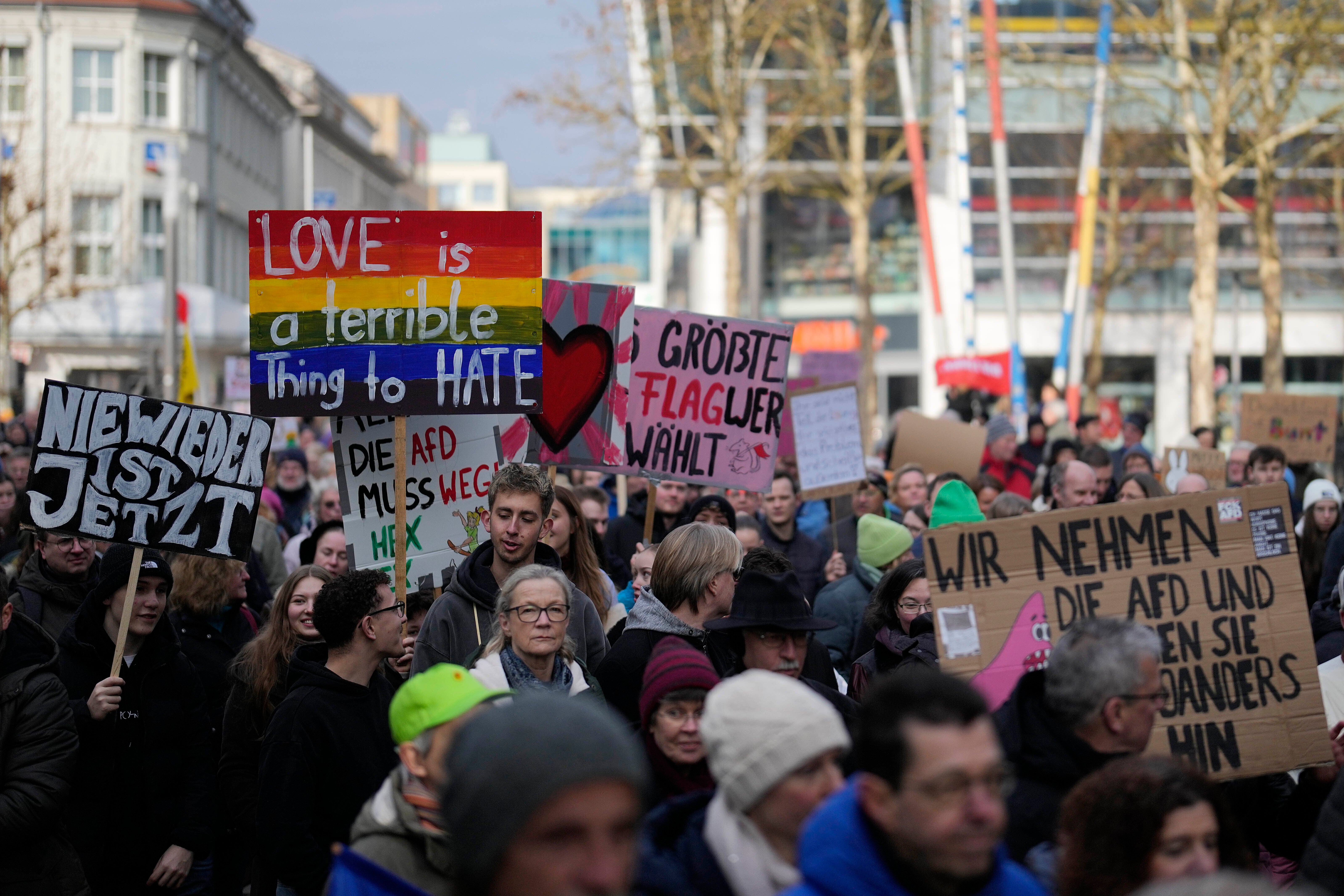 People gather to protest against the far-right AfD