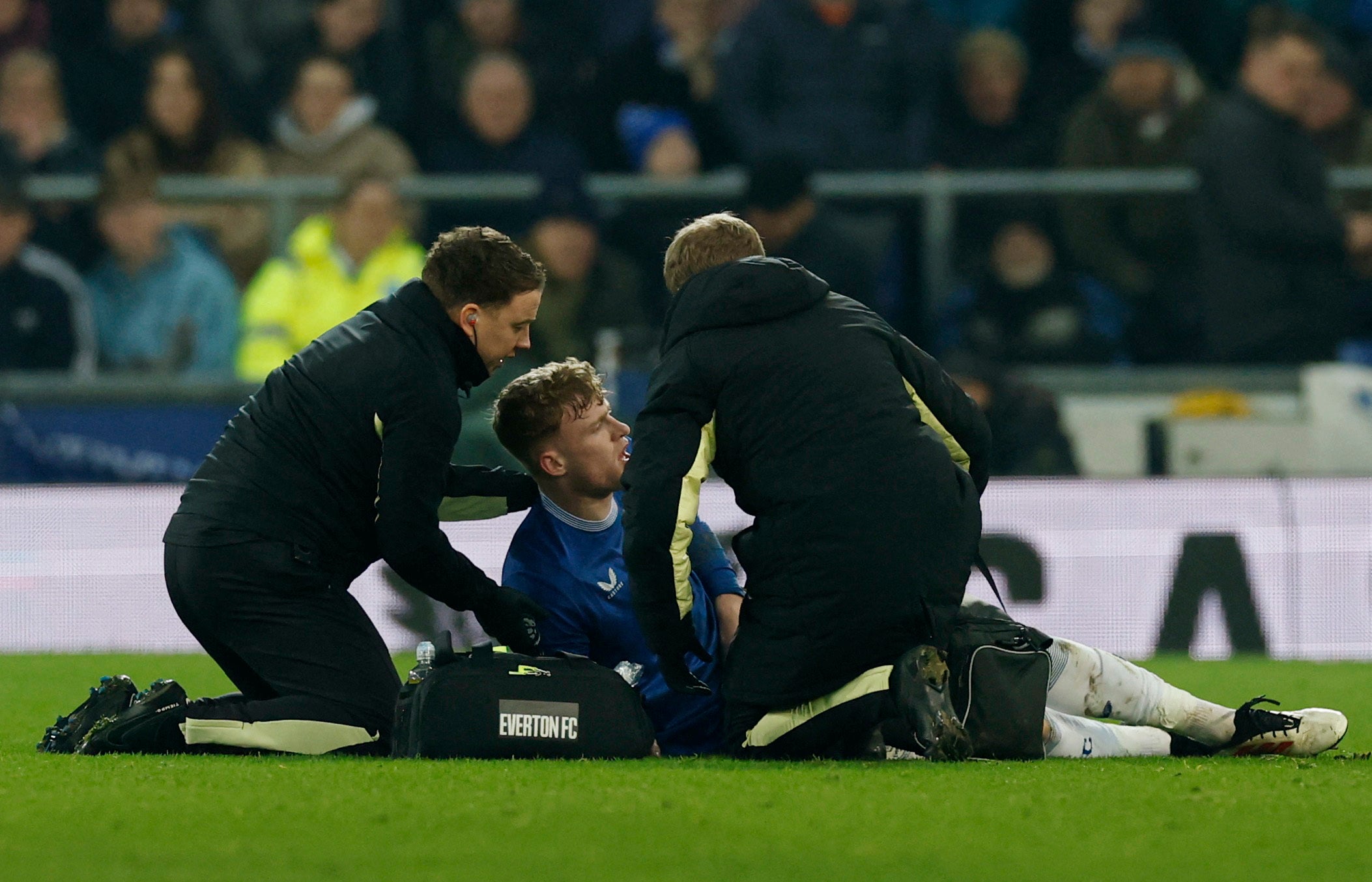 Jarrad Branthwaire is treated after clashing with teammate Carlos Alcaraz