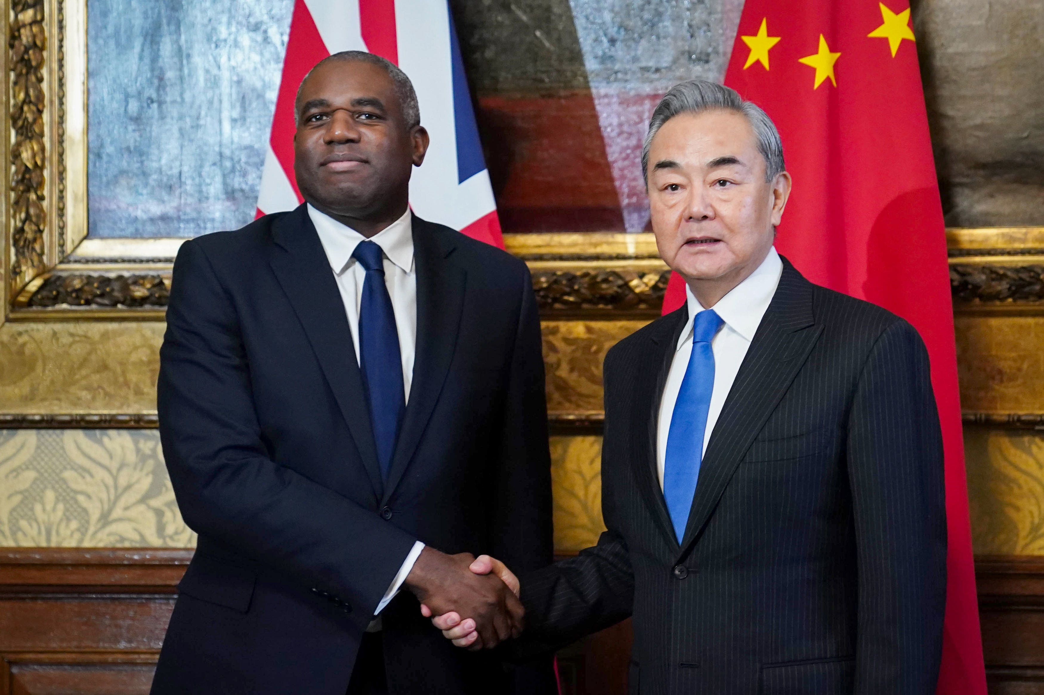 Foreign Secretary David Lammy welcomes China’s foreign affairs minister Wang Yi ahead of a meeting at the Foreign, Commonwealth and Development Office in London. (James Manning/PA)