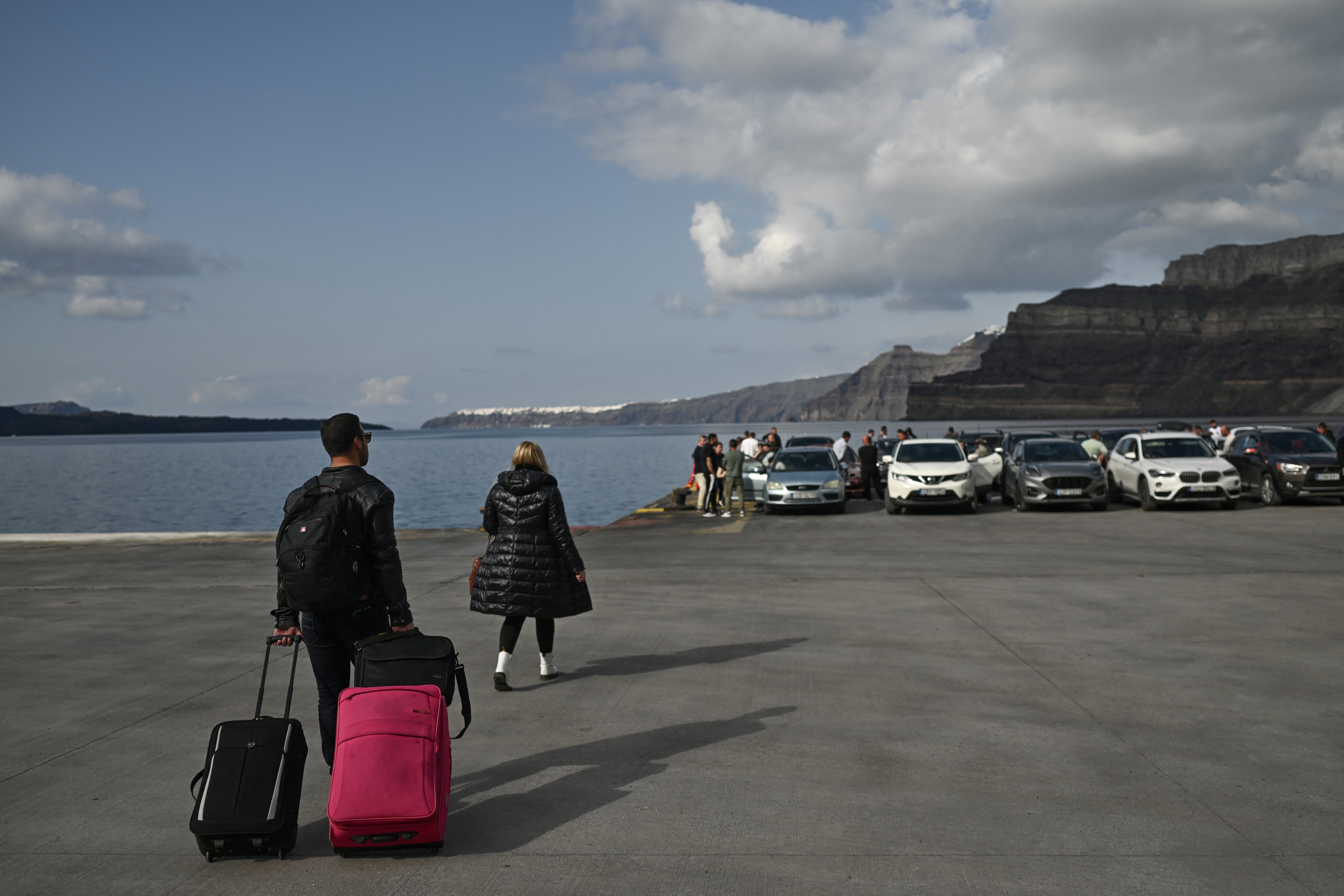 People wait for the ferry on Santorini