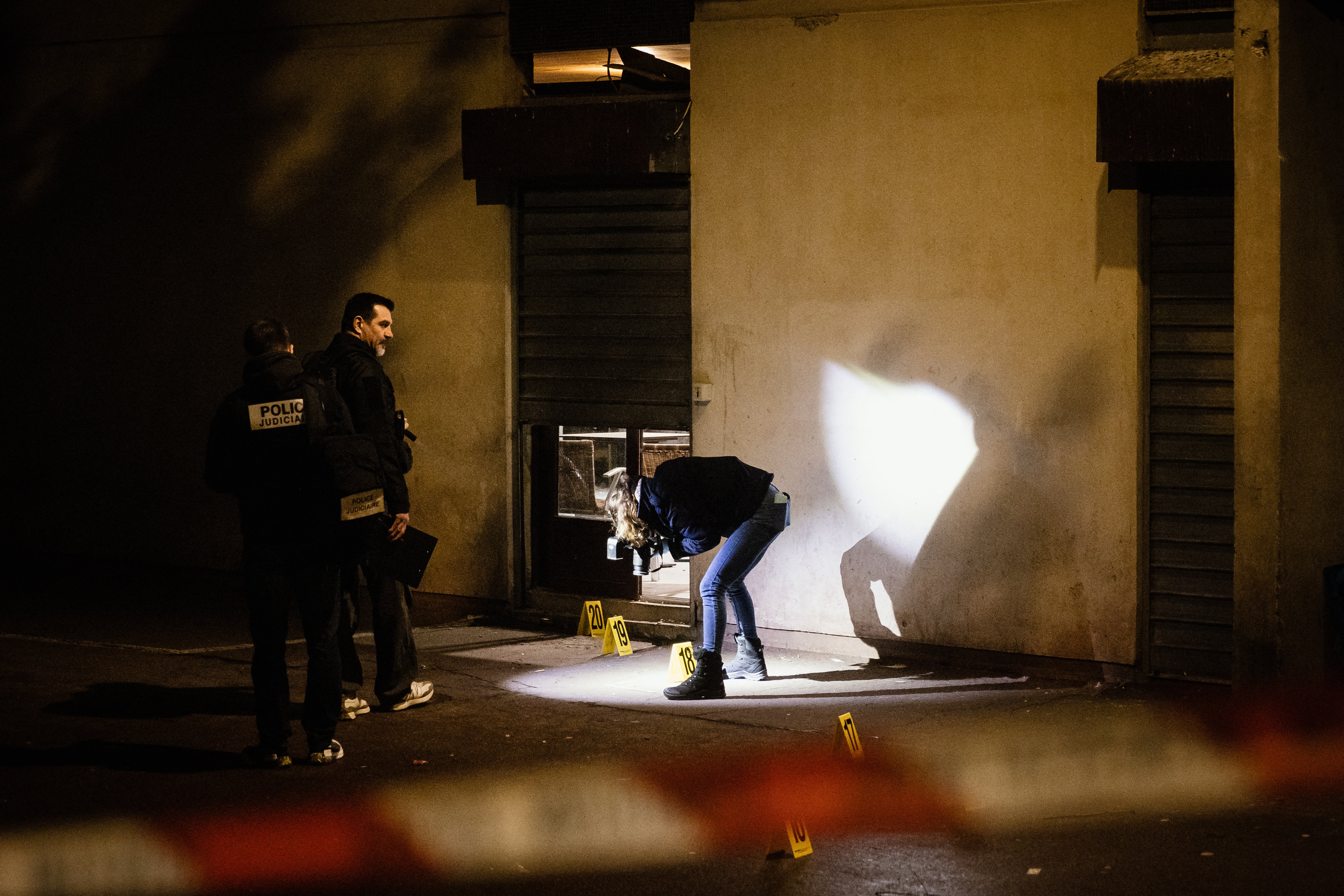 Police investigators work near the scene on Wednesday
