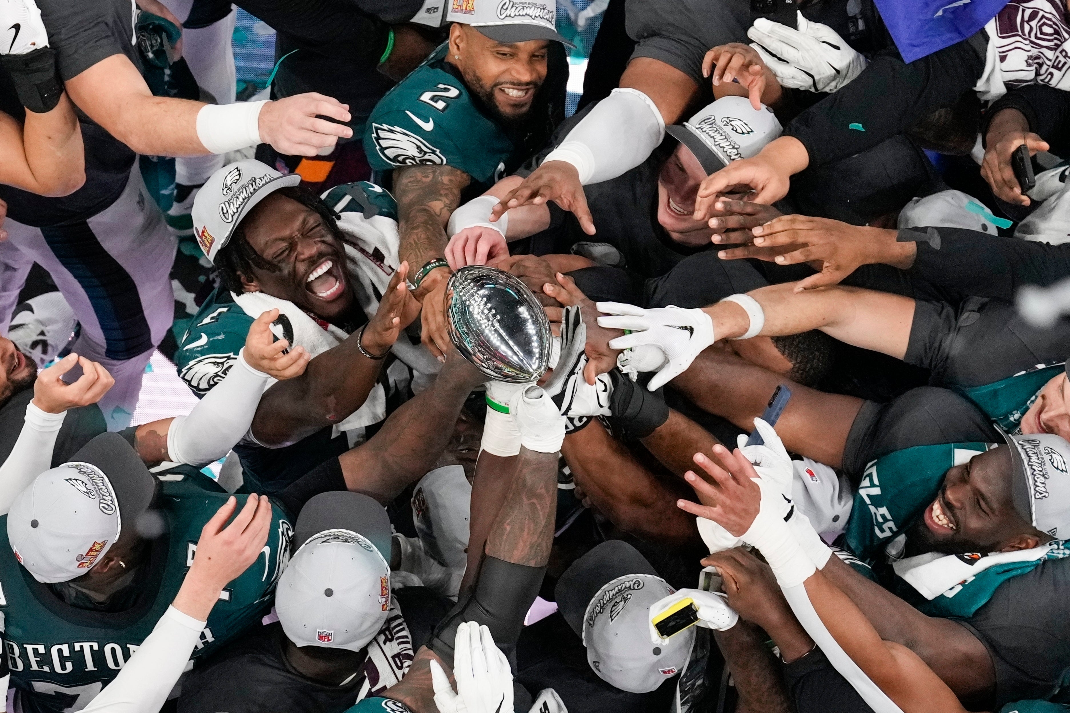 <p>Philadelphia Eagles players celebrate with the Vince Lombardi Trophy after the Eagles won the NFL Super Bowl 59 football game against the Kansas City Chiefs, Sunday, Feb. 9, 2025, in New Orleans. Conflicting reports in media outlets have said that the Eagles are both going to snub a White House visit like they did after their 2018 Super Bowl victory and that they are going to accept an invite, if the White House extends one</p>