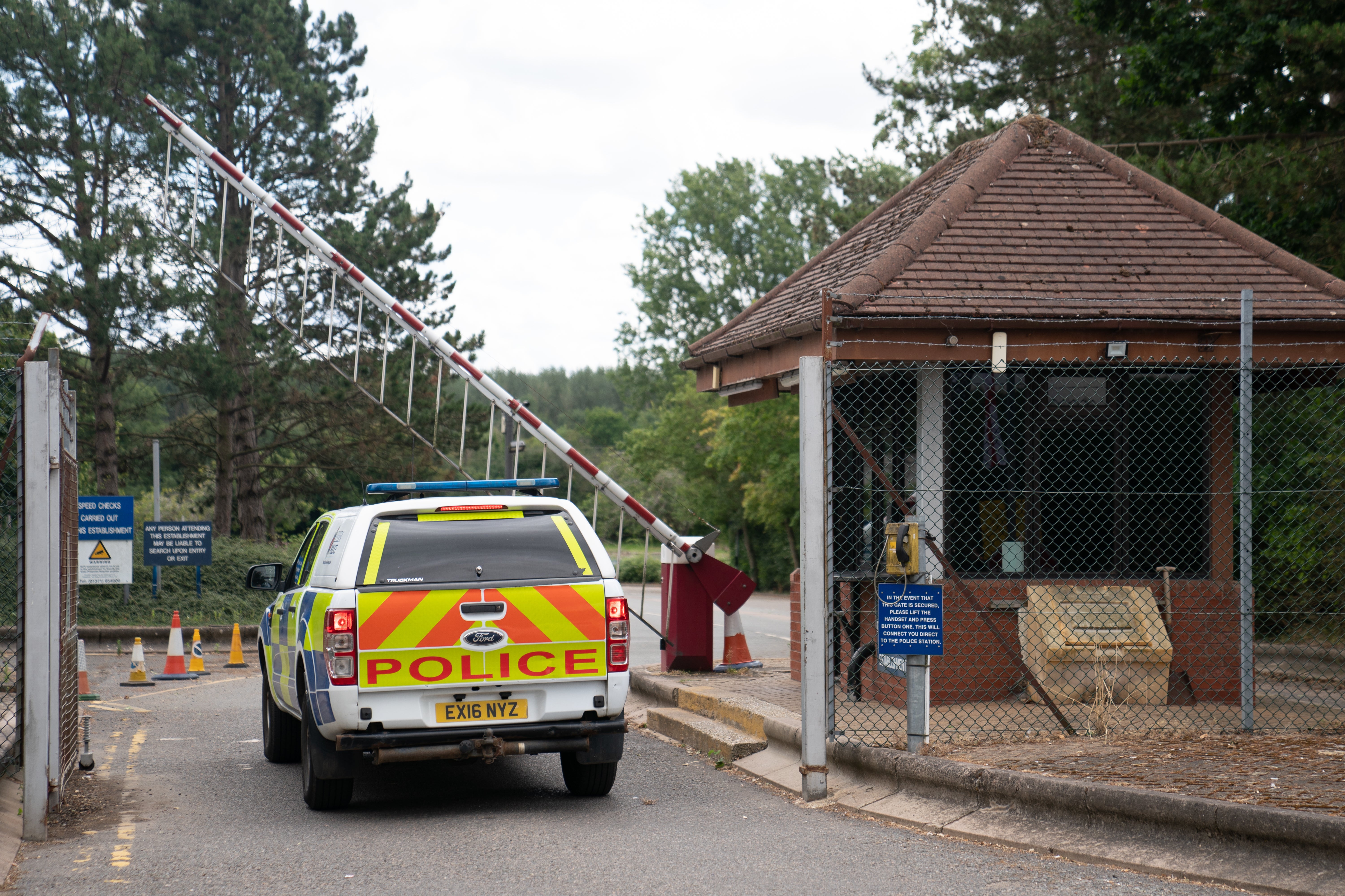 A police vehicle enters the asylum accommodation centre at Wethersfield in Essex