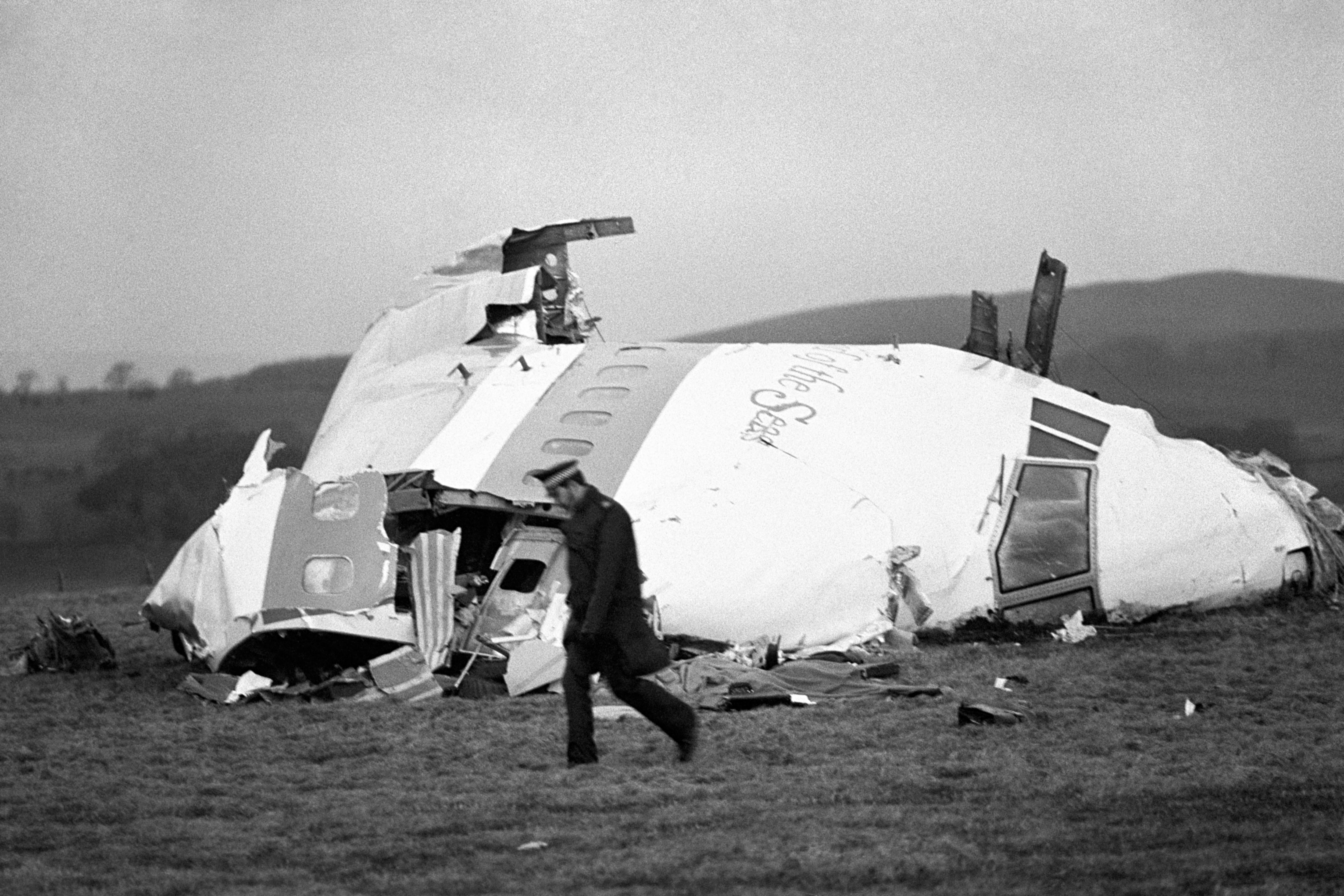 The nose of Pan Am flight 103 lies in a field after the bombing
