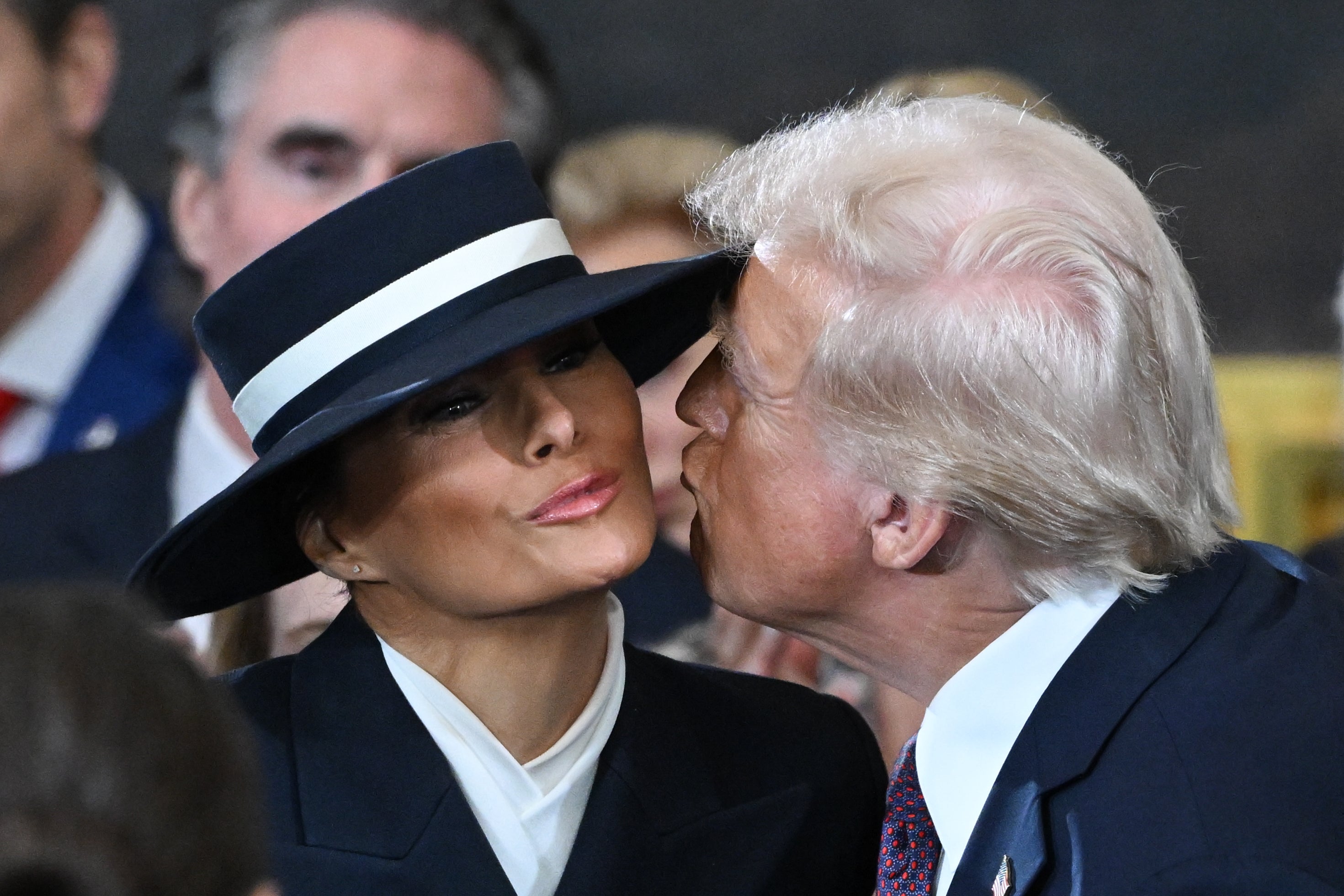 Melania’s wide-brimmed hat at her husband’s inauguration spawned countless memes after Donald struggled to reach her cheek for a kiss