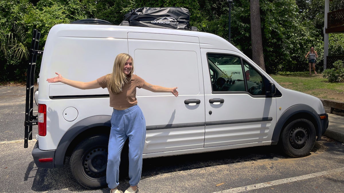 Gabby in front of her beloved van