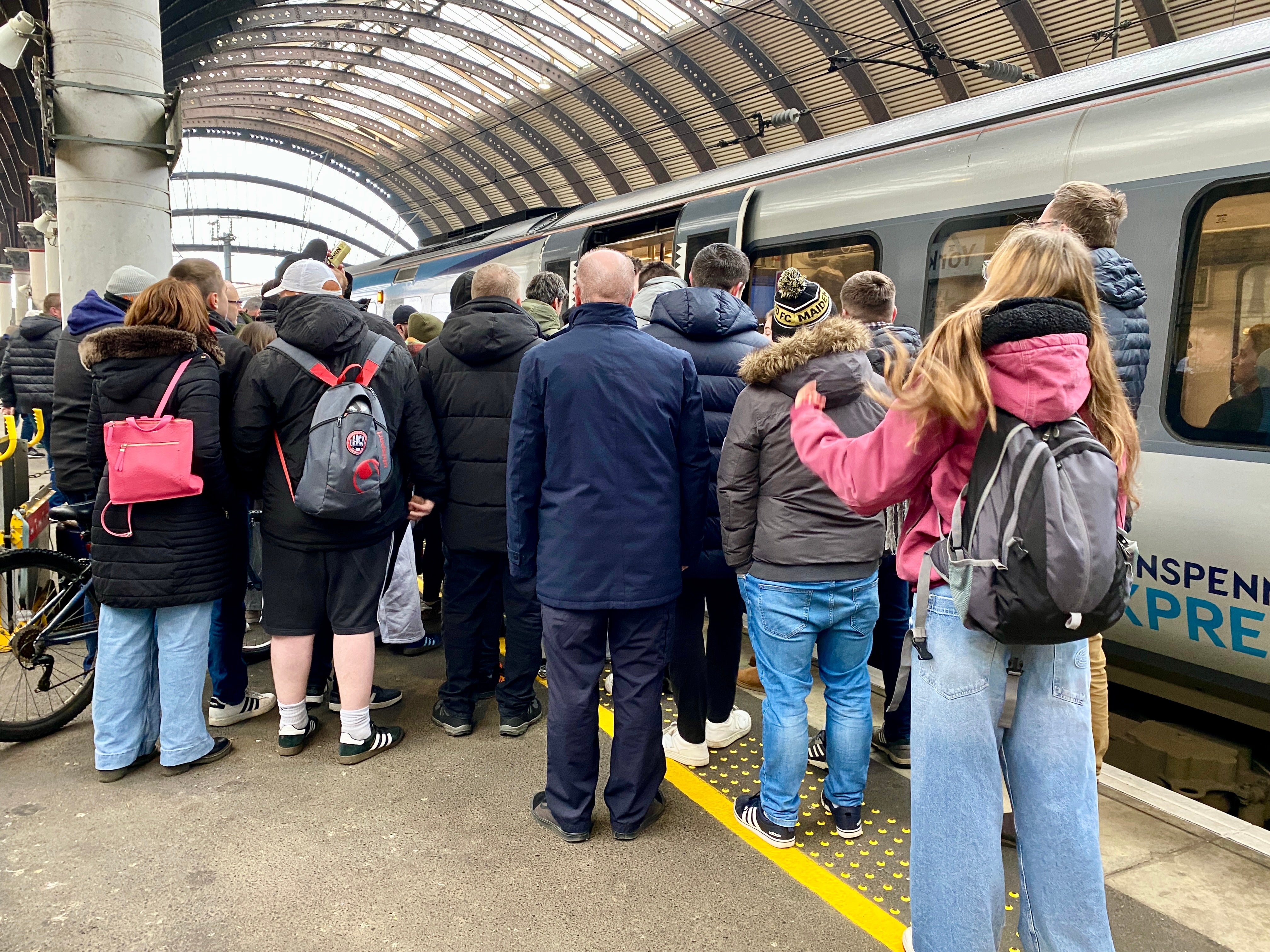 Big squeeze: passengers turfed off a Grand Central train at York try to board a smaller TransPennine Express service