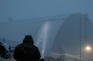 The damaged containment vessel at the New Safe Confinement, which protects the remains of reactor 4 of the former Chernobyl Nuclear Power Plant to contain radiation, seen following a drone attack in Chernobyl