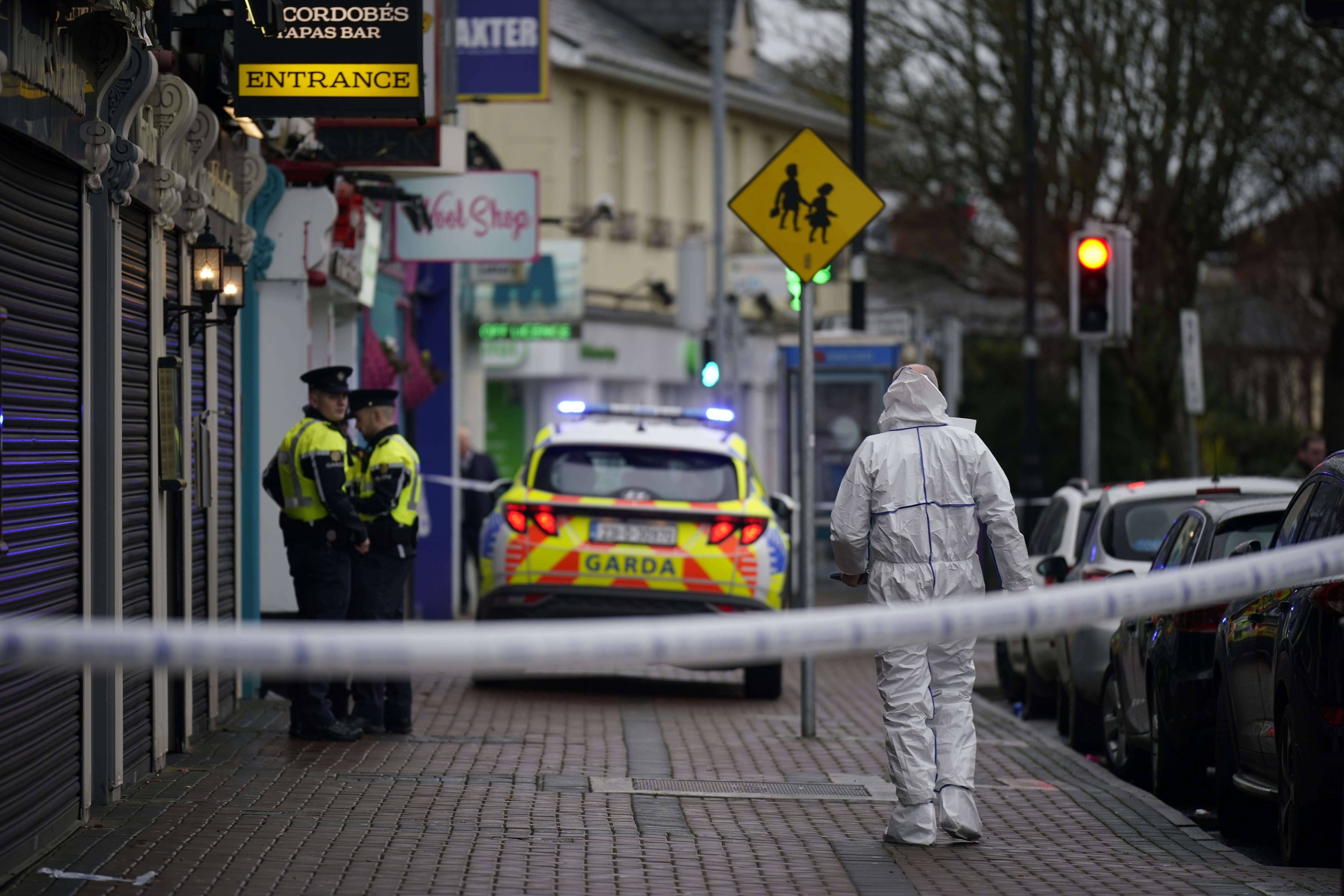 A forensic investigator at the scene in Blanchardstown, Dublin, in December 2023 (Niall Carson/PA)