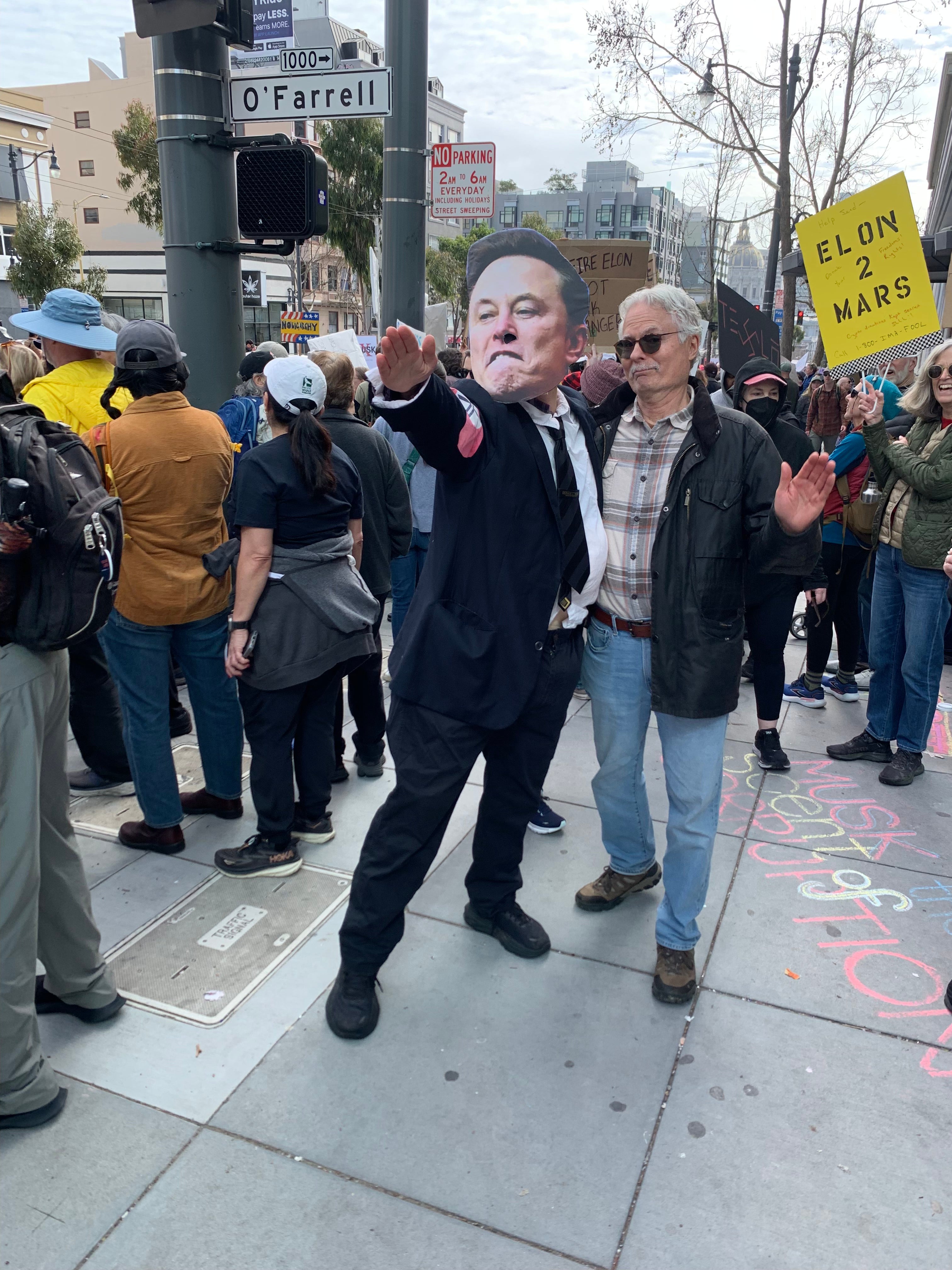 Protester in Elon Musk mask flashes a ‘sieg heil’ Nazi salute in front of a Tesla showroom in San Francisco last month