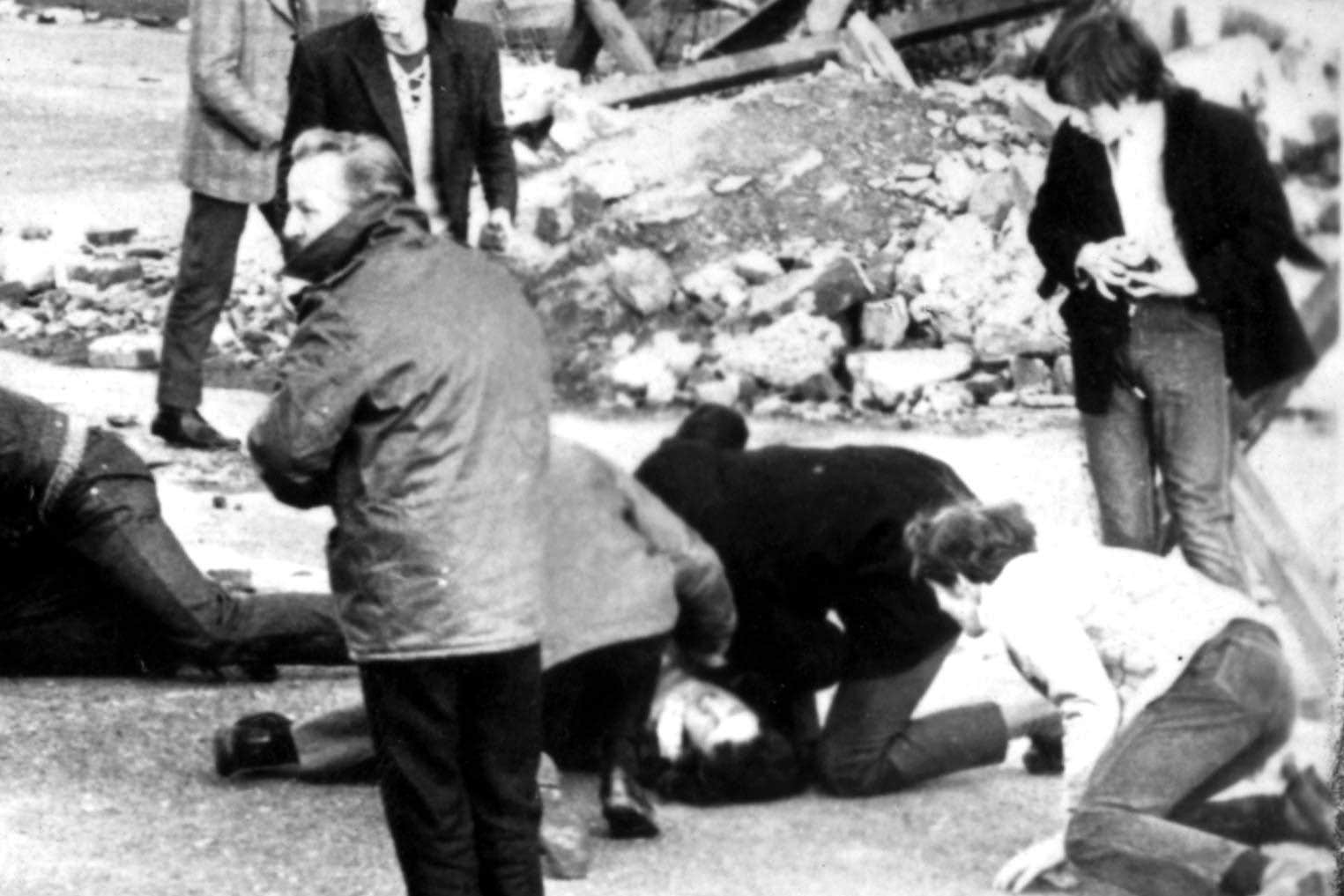 A man receiving attention during the Bloody Sunday shooting incident (PA)