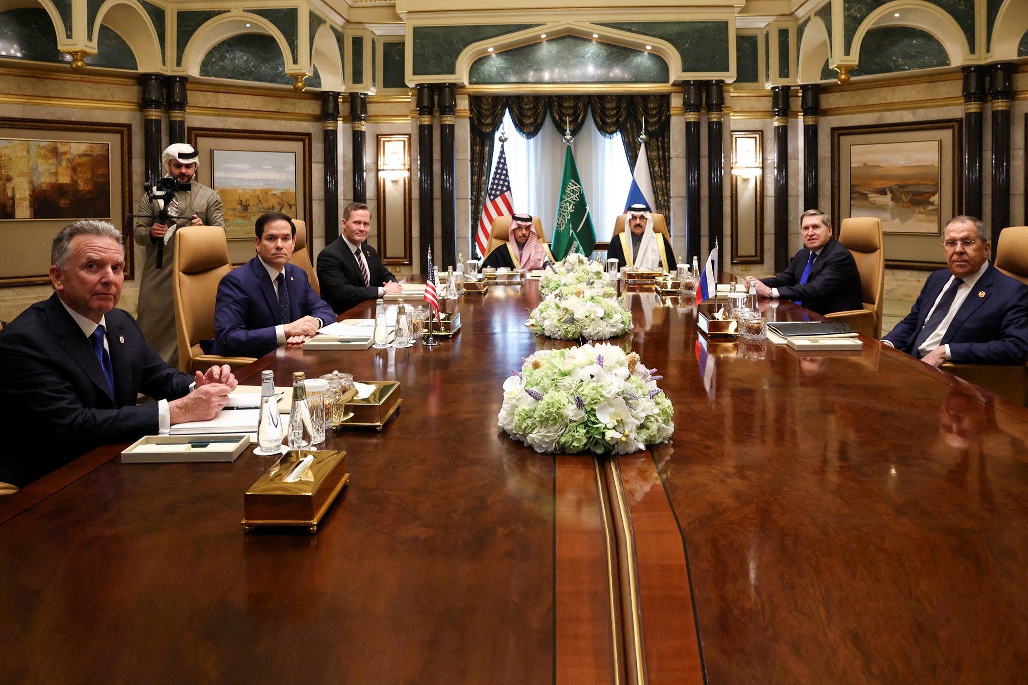 <p>The US and Russian delegations face each other across the table in Riyadh on Tuesday</p>