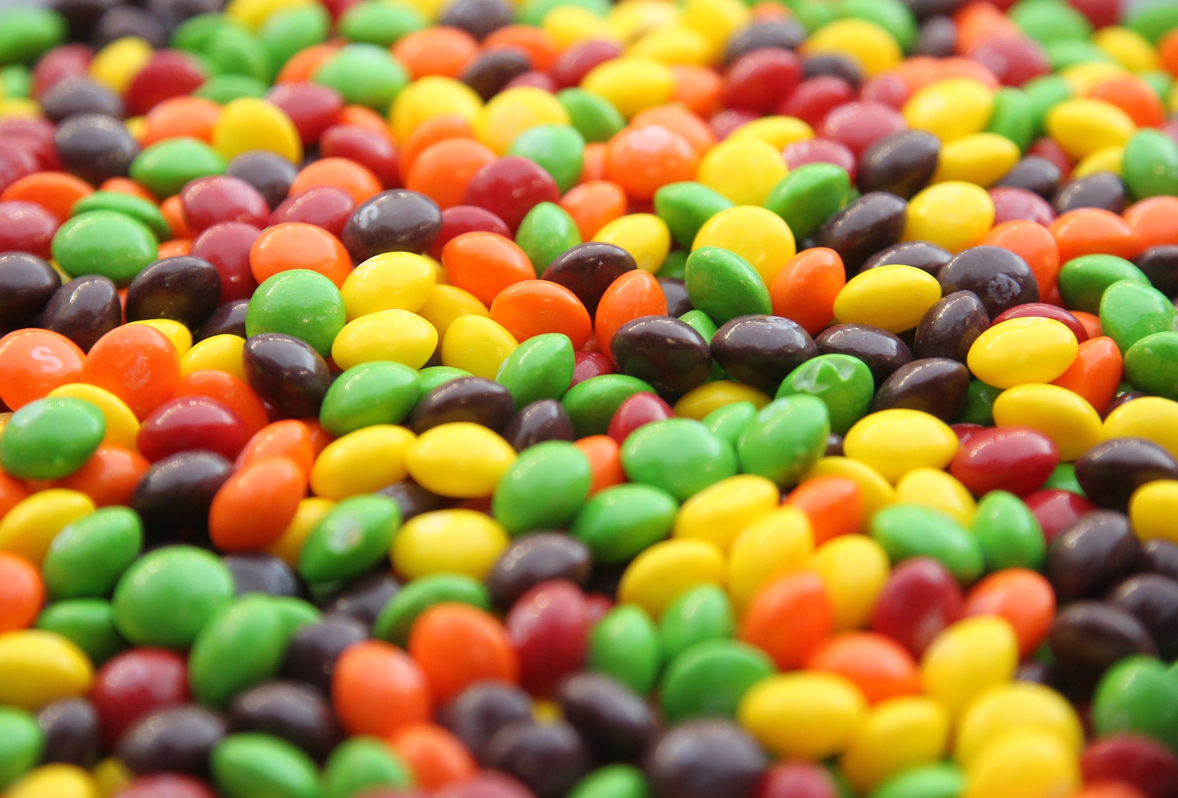 A closeup of a bowl of Skittles