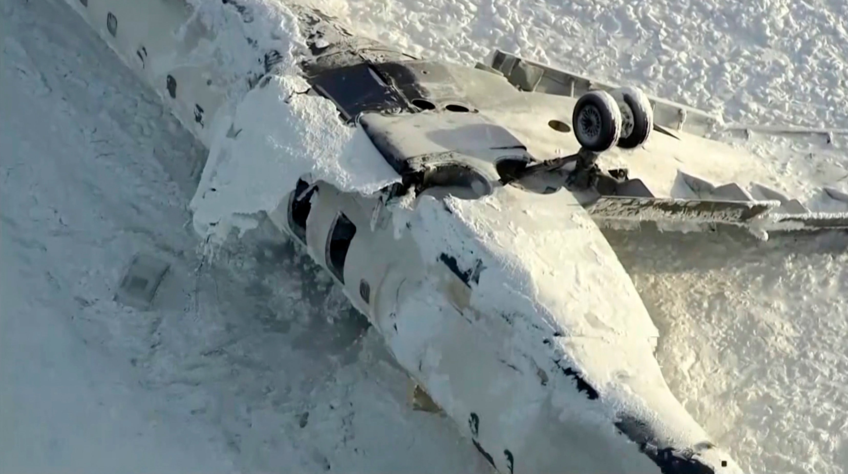 An aerial view of the overturned plane