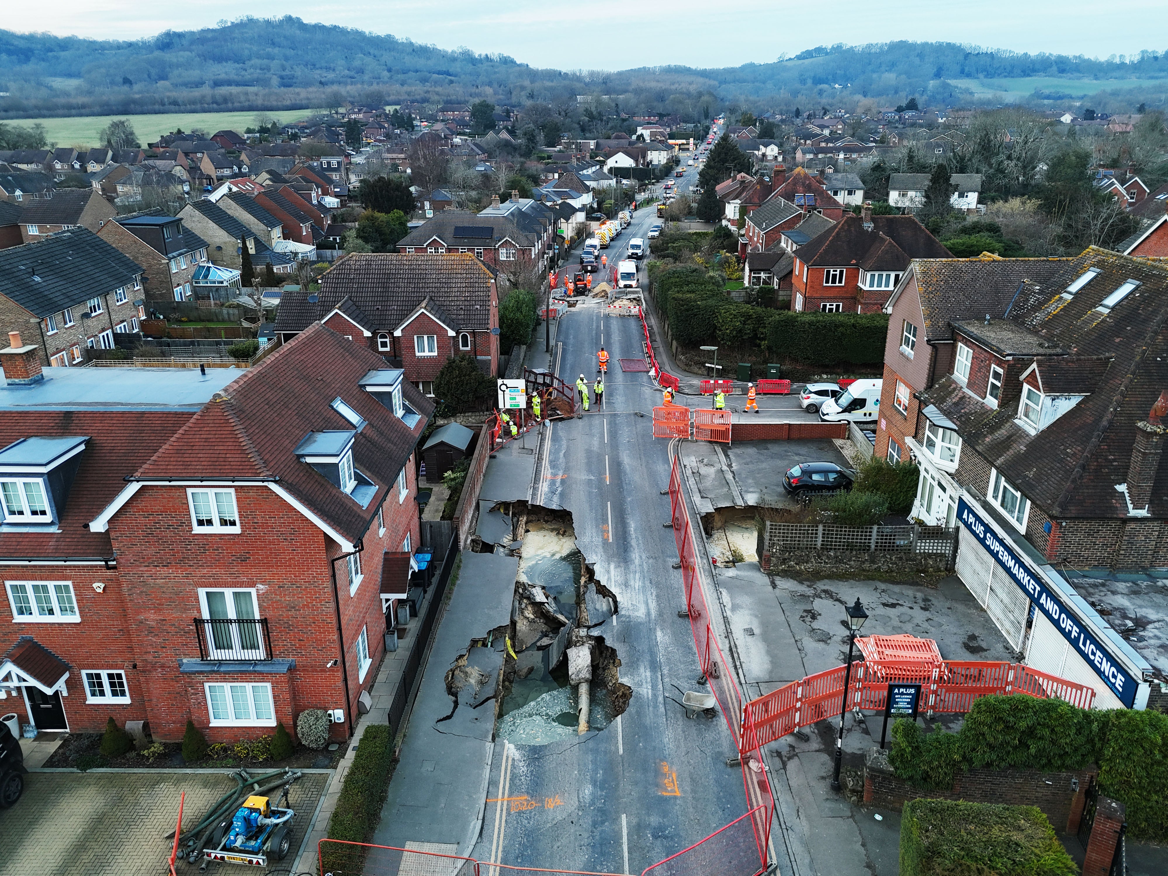The large sinkhole has forced the closure of the high street in Godstone (Jonathan Brady/PA)