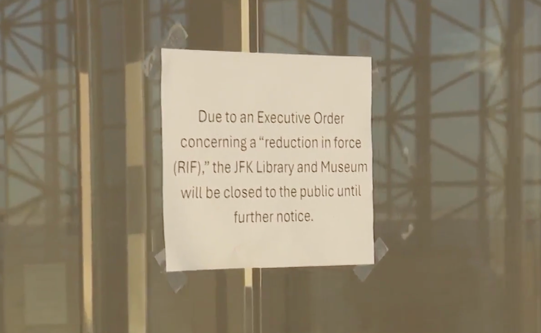 A sign at the JFK Presidential Library announces that the library will be closed 'until further notice' following layoffs by the Trump administration