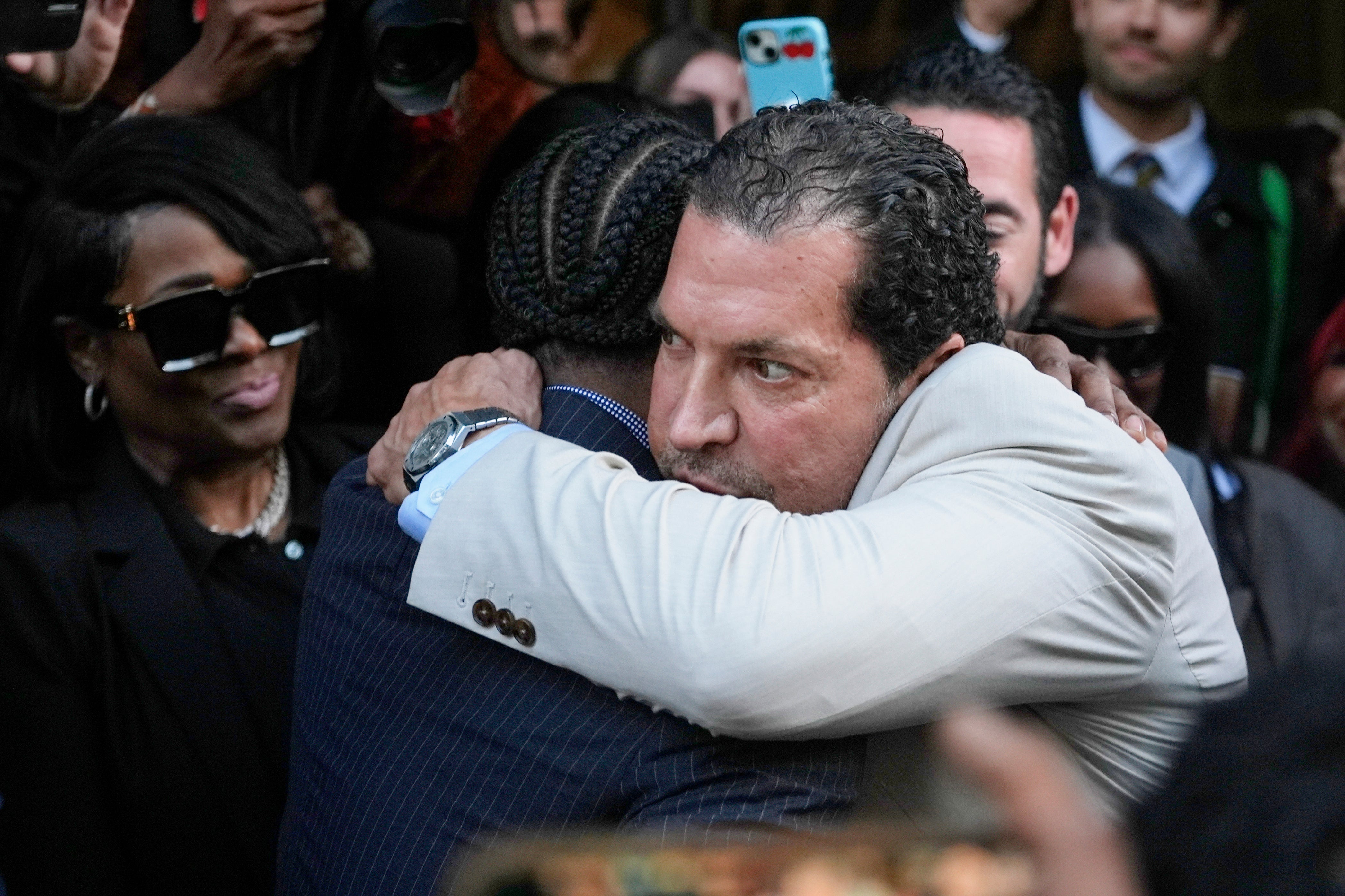 A$AP Rocky hugs attorney Joe Tacopina outside court