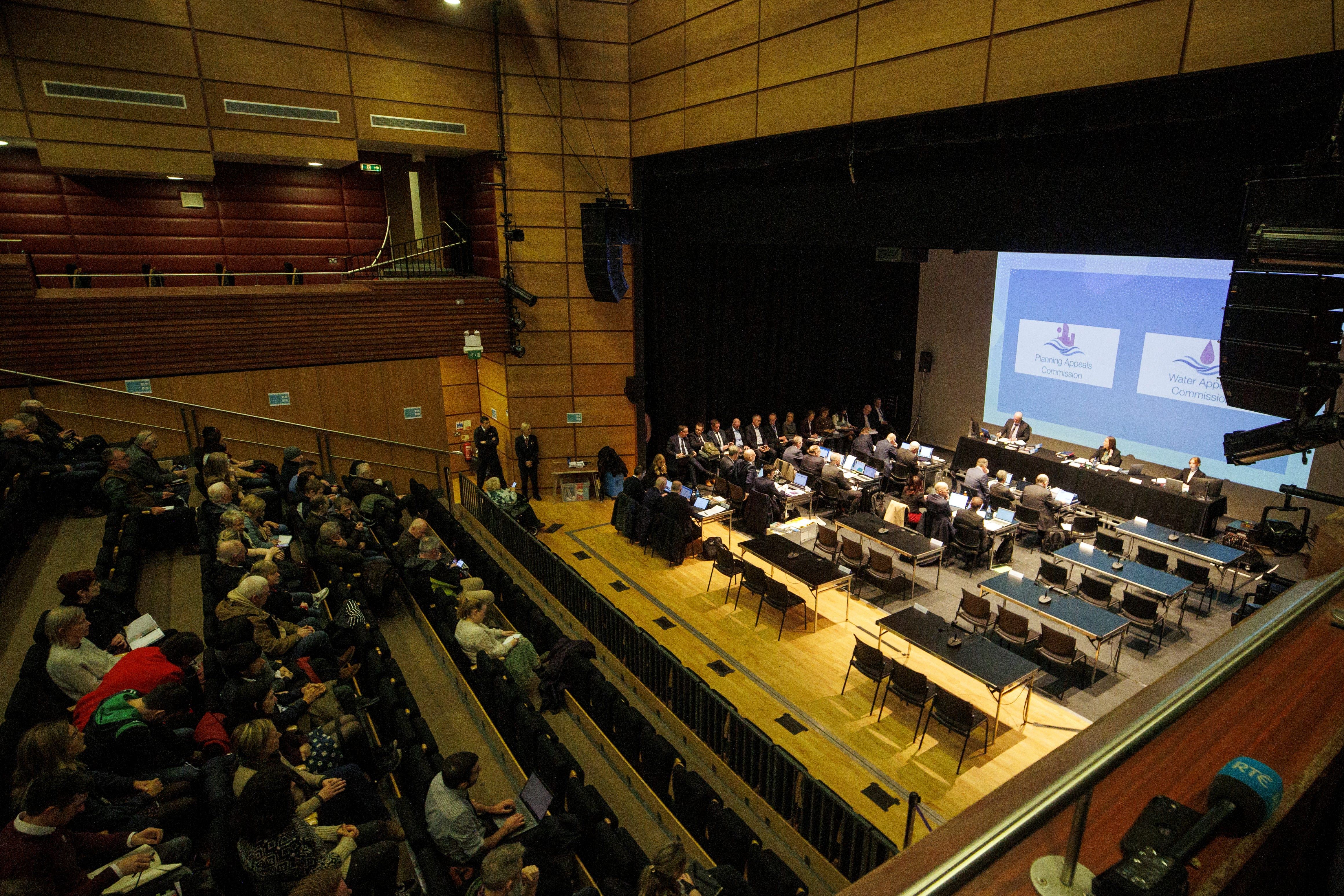 Jacqueline McParland (centre of top table), Senior Commissioner at The Planning and Water Appeals Commission at Strule Arts Centre in Omagh, during the public inquiry into the controversial planning application for the Dalradian Gold Mine project at Greencastle, County Tyrone (Liam McBurney/PA)