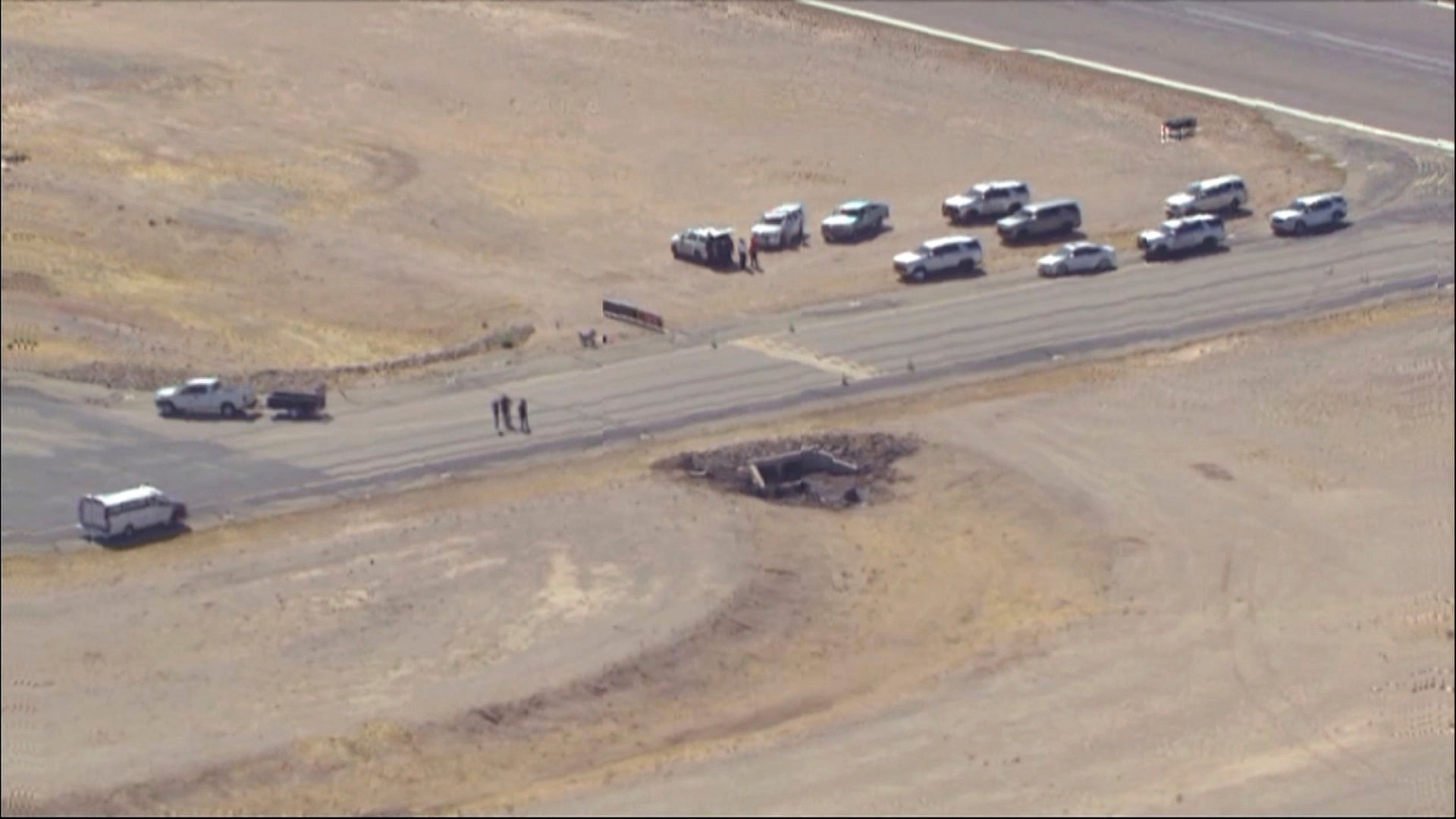 Law enforcement at the site of a deadly plane crash at Marana Regional Airport on Wednesday