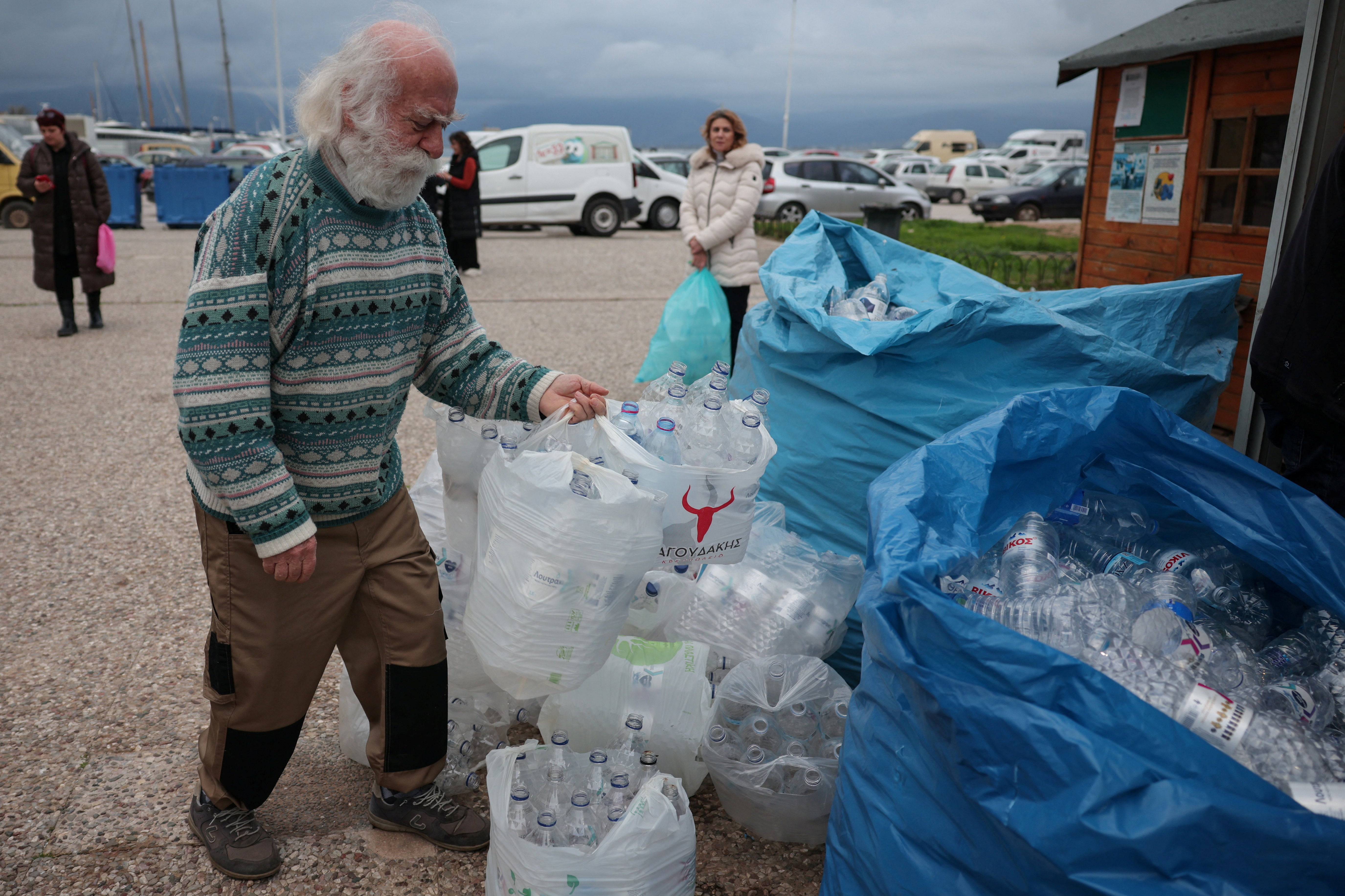 Locals recycle water bottles, as most of the residents rely on bottled water, at the recycling station in the city of Nafplion, Greece