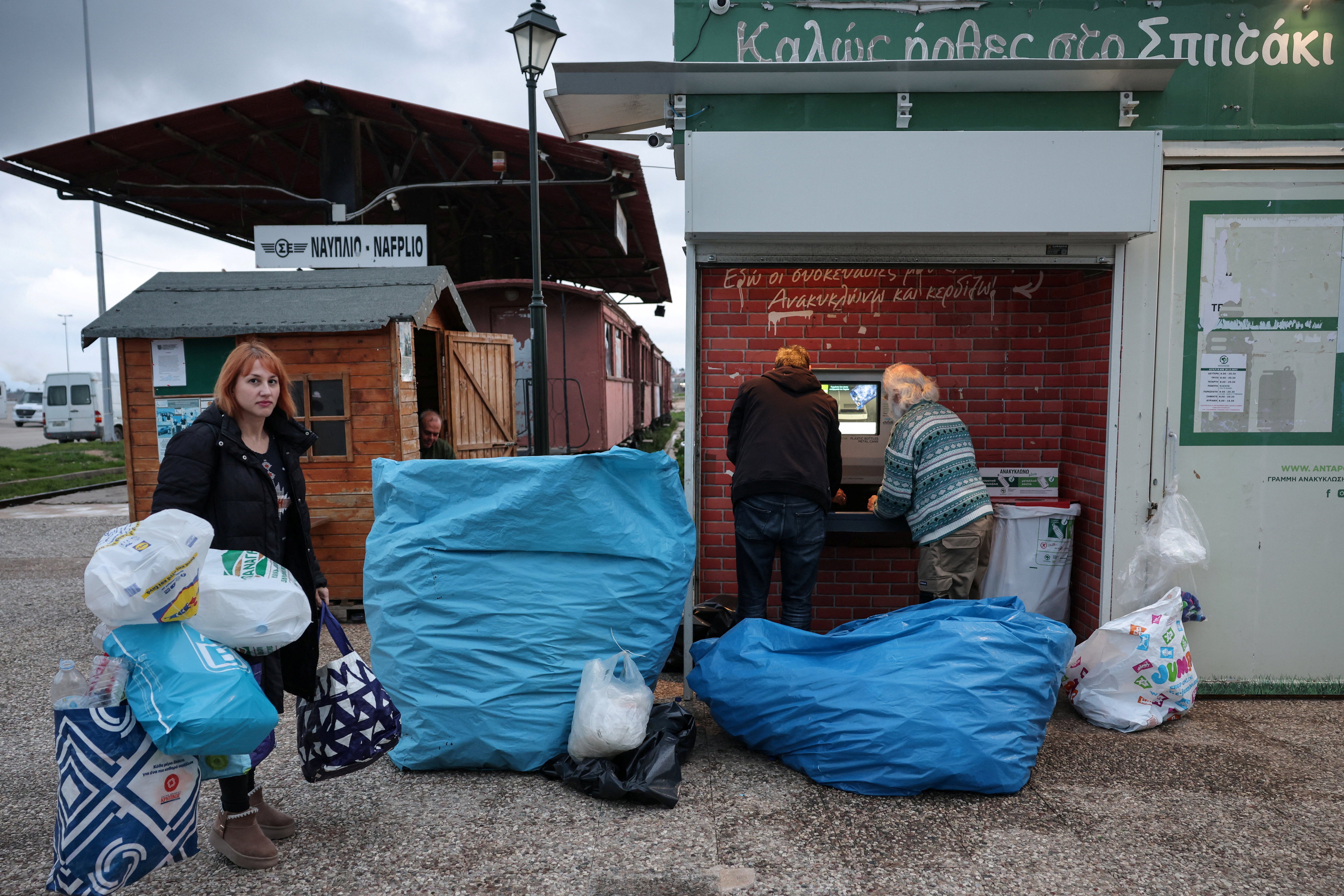 Locals recycle water bottles, as most residents rely on bottled water, at the recycling station in the city of Nafplion, Greece, February 3