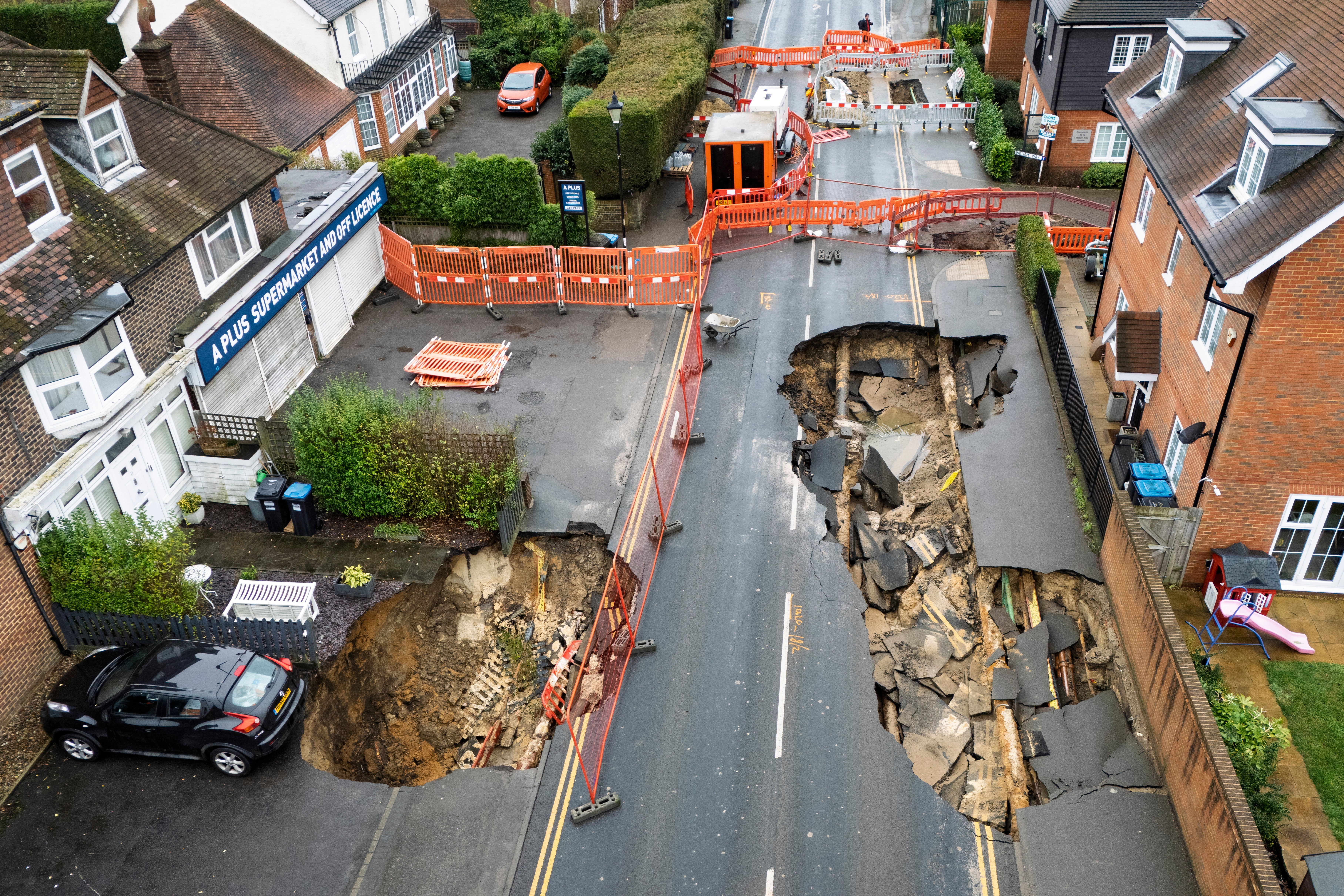 One car was left teetering on the edge of the sinkhole