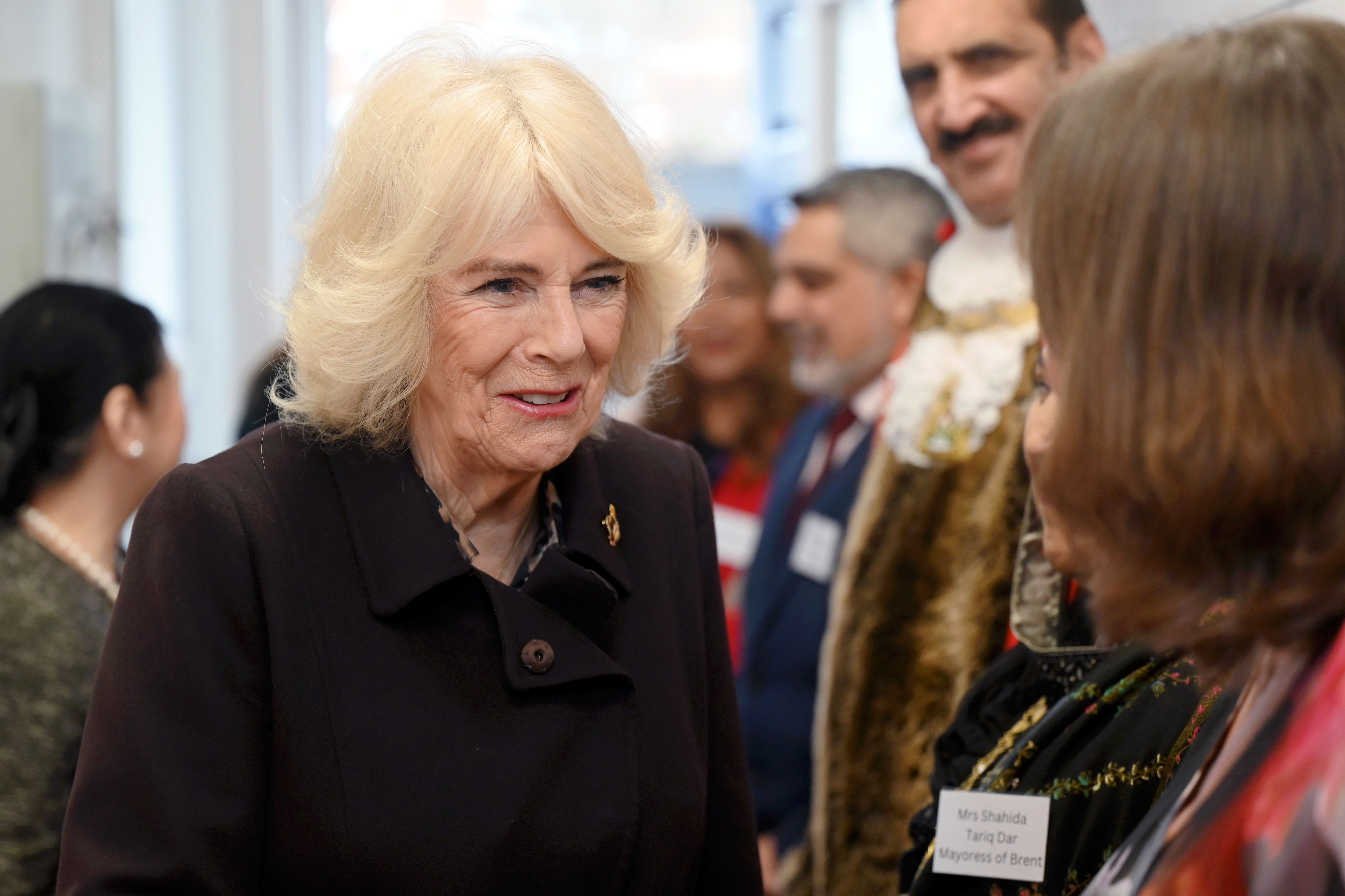 Queen Camilla talks to guests during a visit to the Asian Women’s Resource Centre in north London (Stuart Wilson/PA)