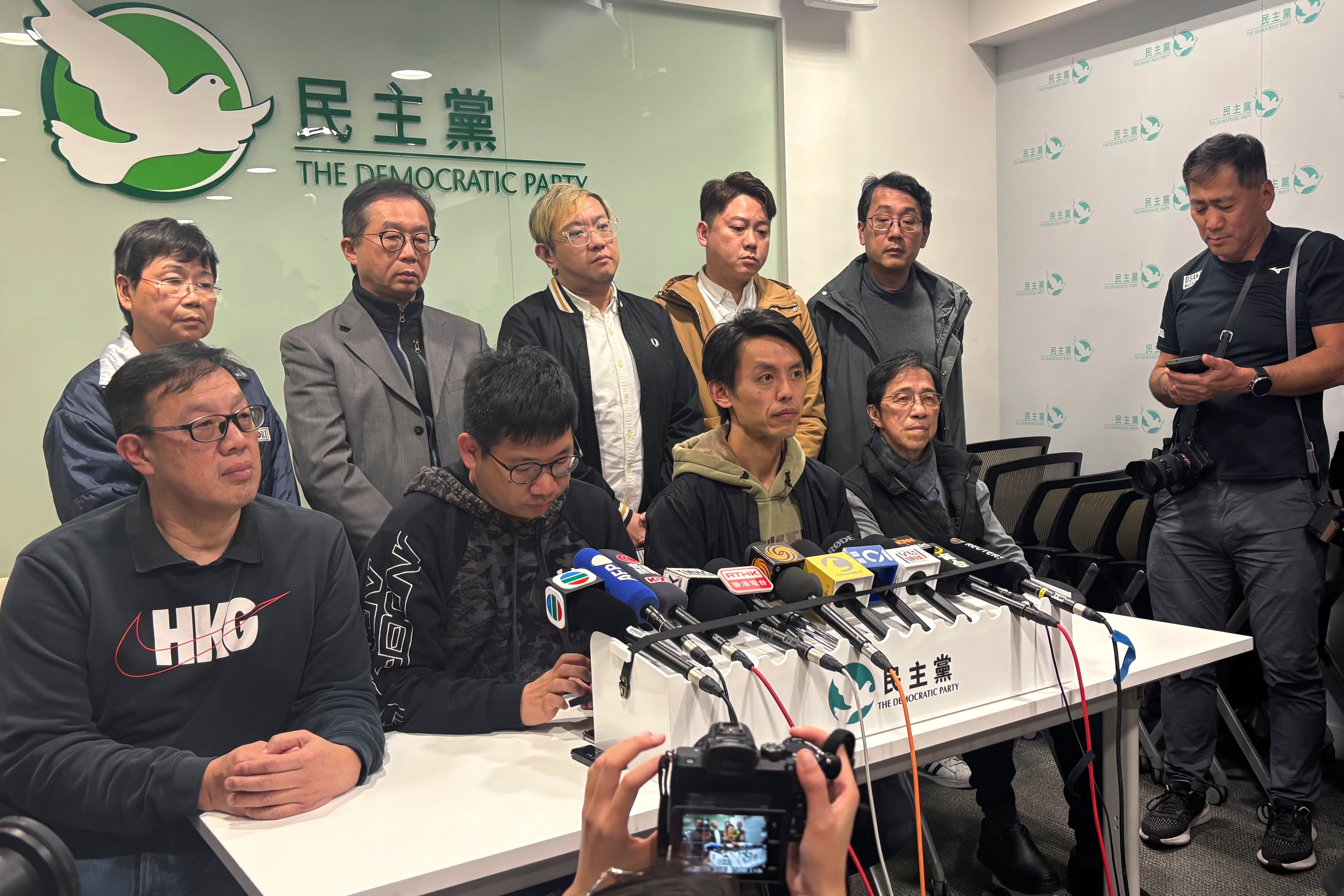 Hong Kong Democratic Party chair Lo Kin Hei, seated second from right, at a press conference on 20 February 2025