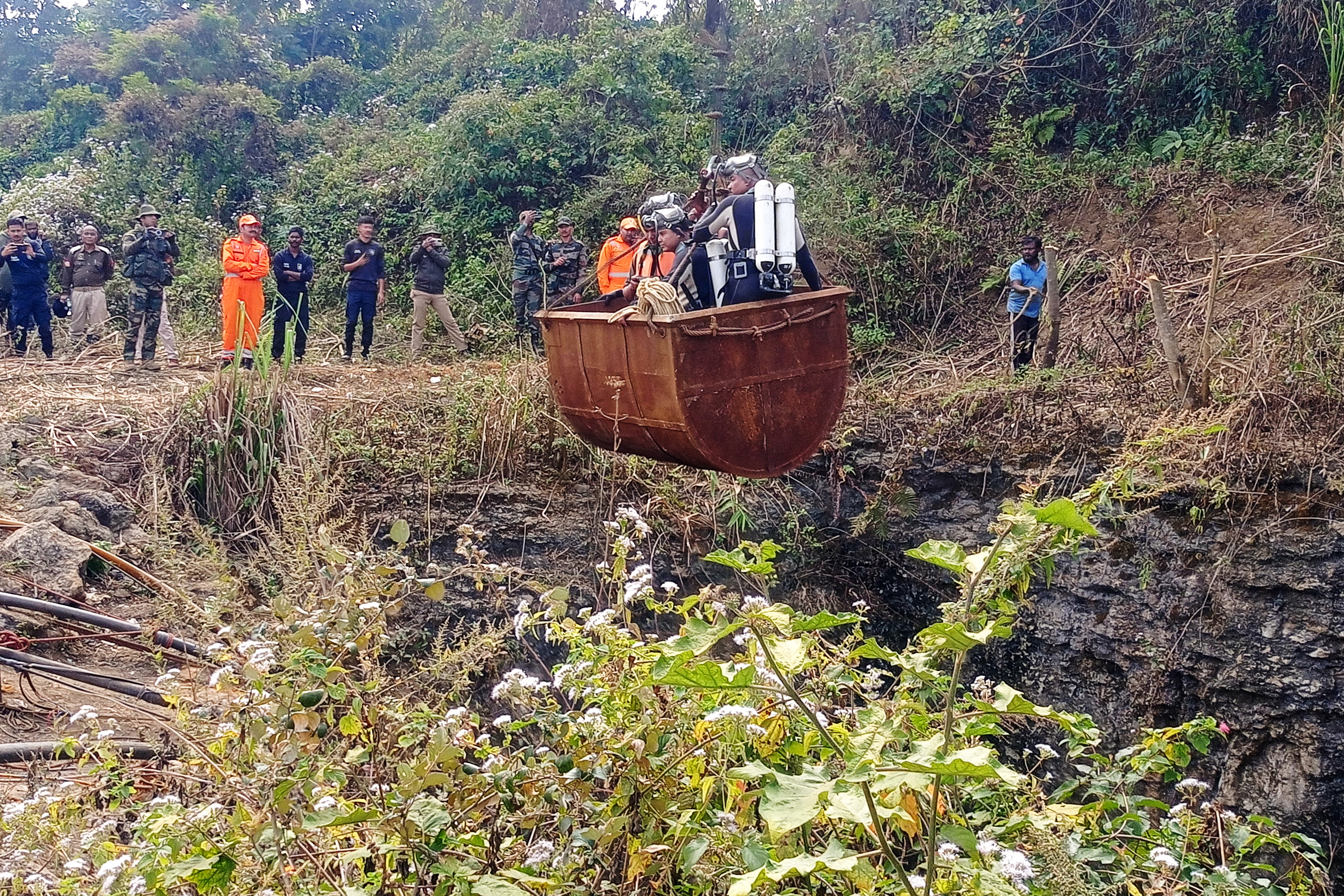 File. Divers enter a flooded coal mine in Umrangso, Assam, on 7 January 2025