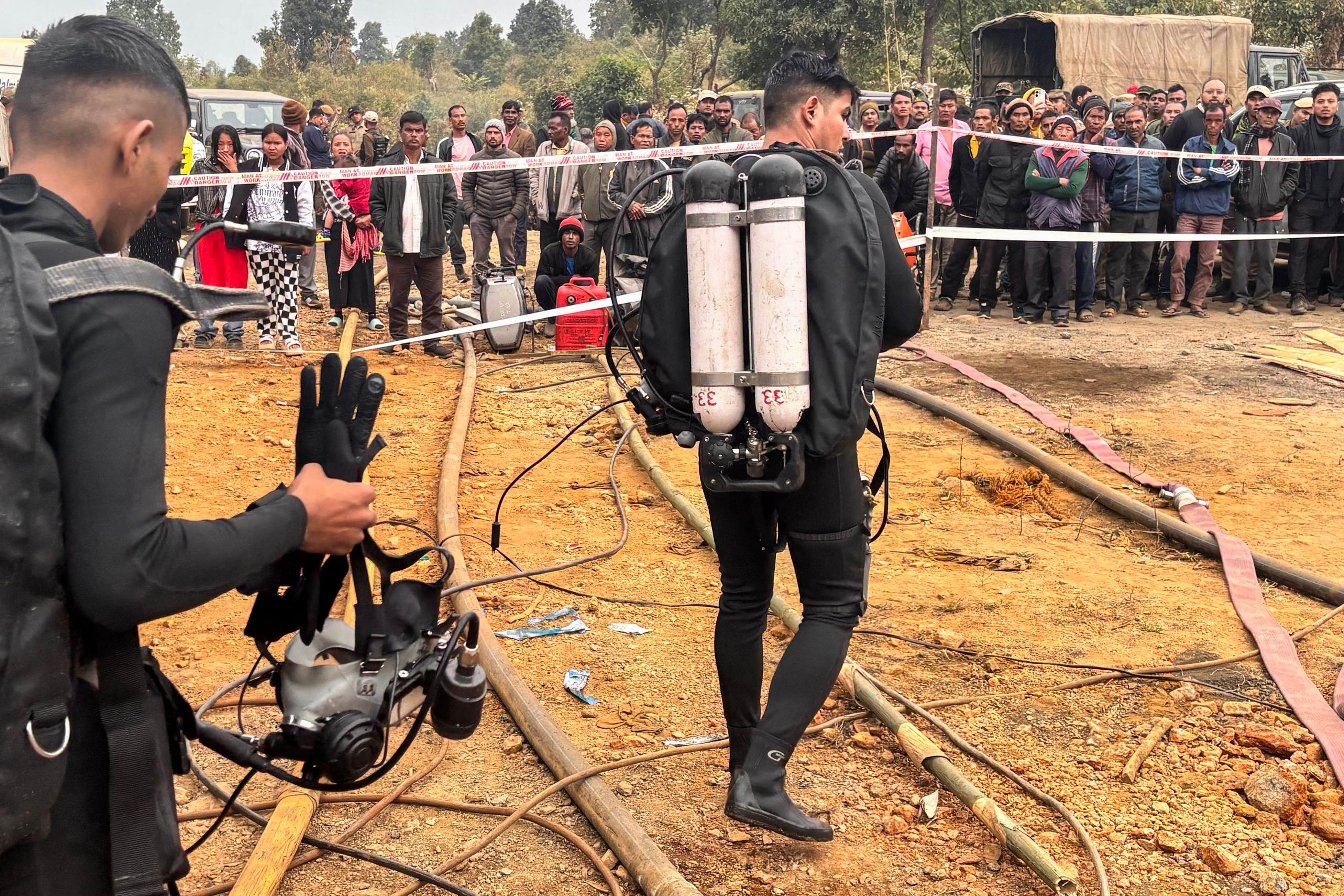 File. Indian navy divers come out of the flooded coal mine in Umrangso, Assam, on 8 January 2025