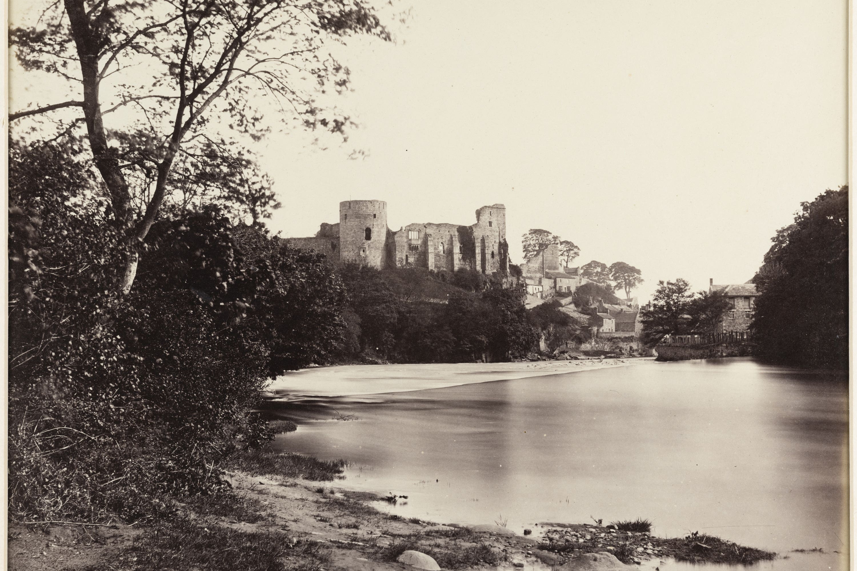 A view looking along the River Tees towards the ruins of Barnard Castle, Barnard Castle, County Durham, by James Mudd, is one of more than 8,000 original black and white photographs offering a rare ‘glimpse into the past’ have been acquired by Historic England (Historic England Archive/PA)