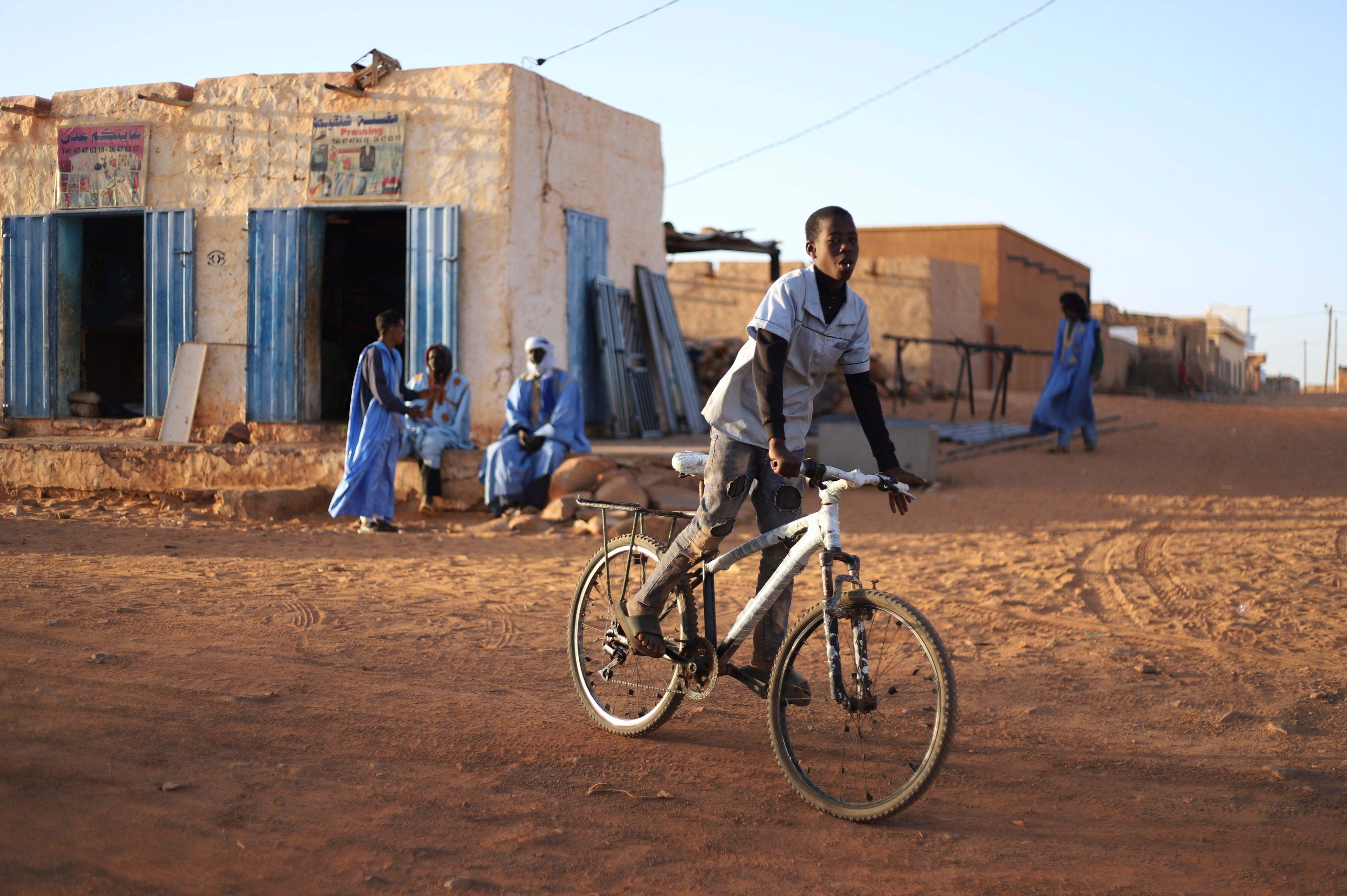 A child rides his bike in Chinguetti, Mauritania on 4 February 2025