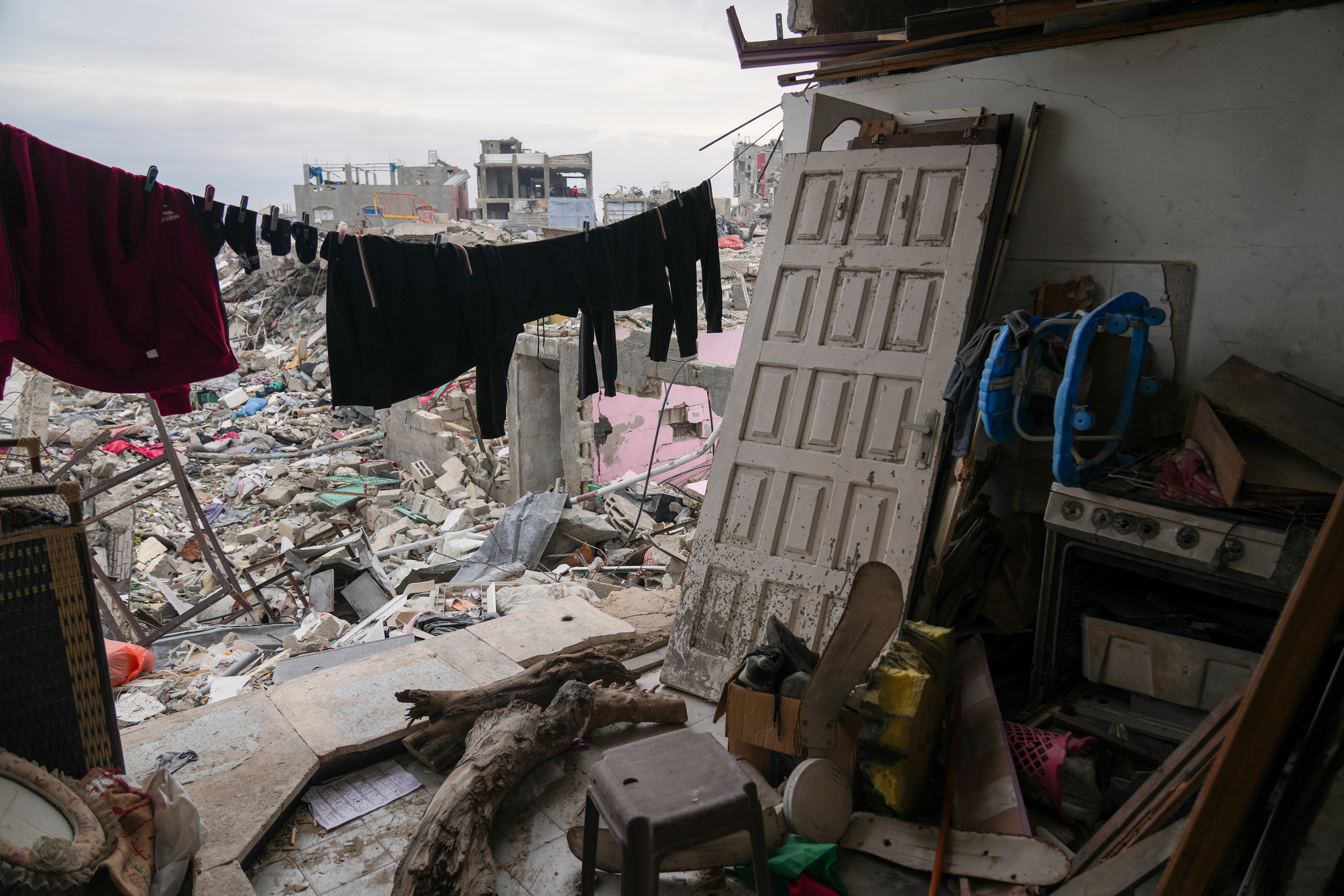 Clothes hang outside a destroyed room belonging to the Nassar family in the Jabalia refugee camp in the northern Gaza Strip