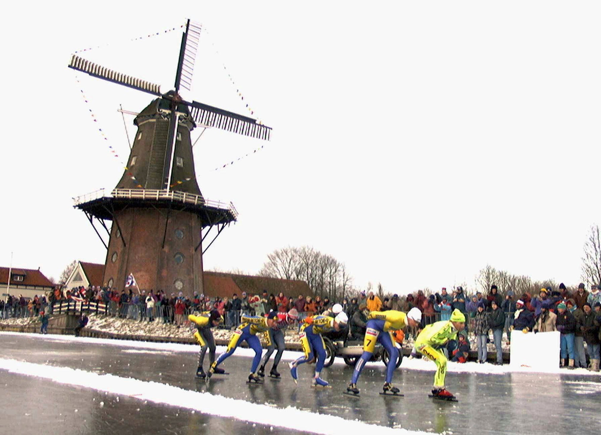 Skaters pass a windmill at the village of Birdaard, northern Netherlands during the ‘Elfstedentoch’ (eleven-cities-course) race on Jan. 4, 1997