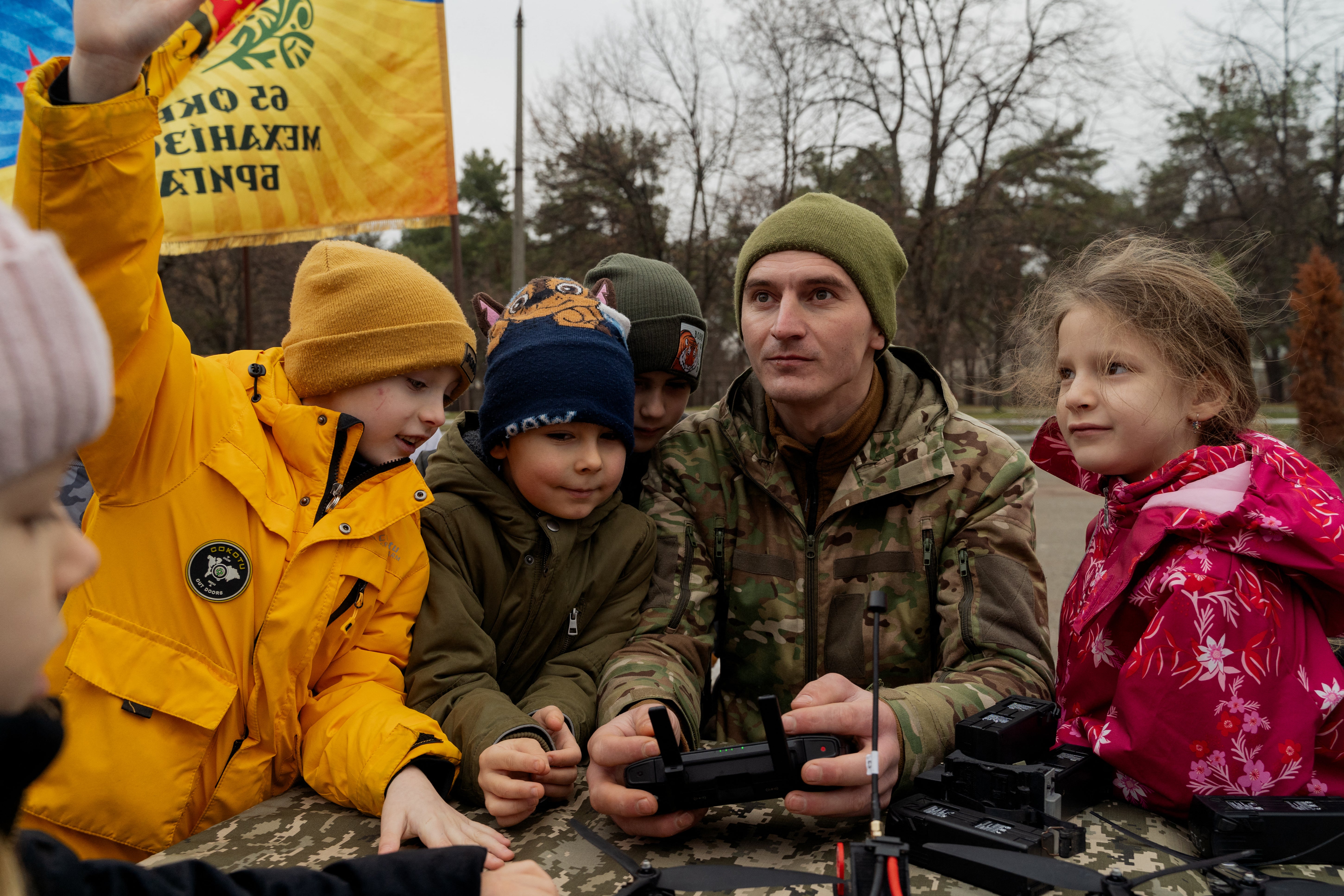 A Ukrainian serviceman demonstrates a drone