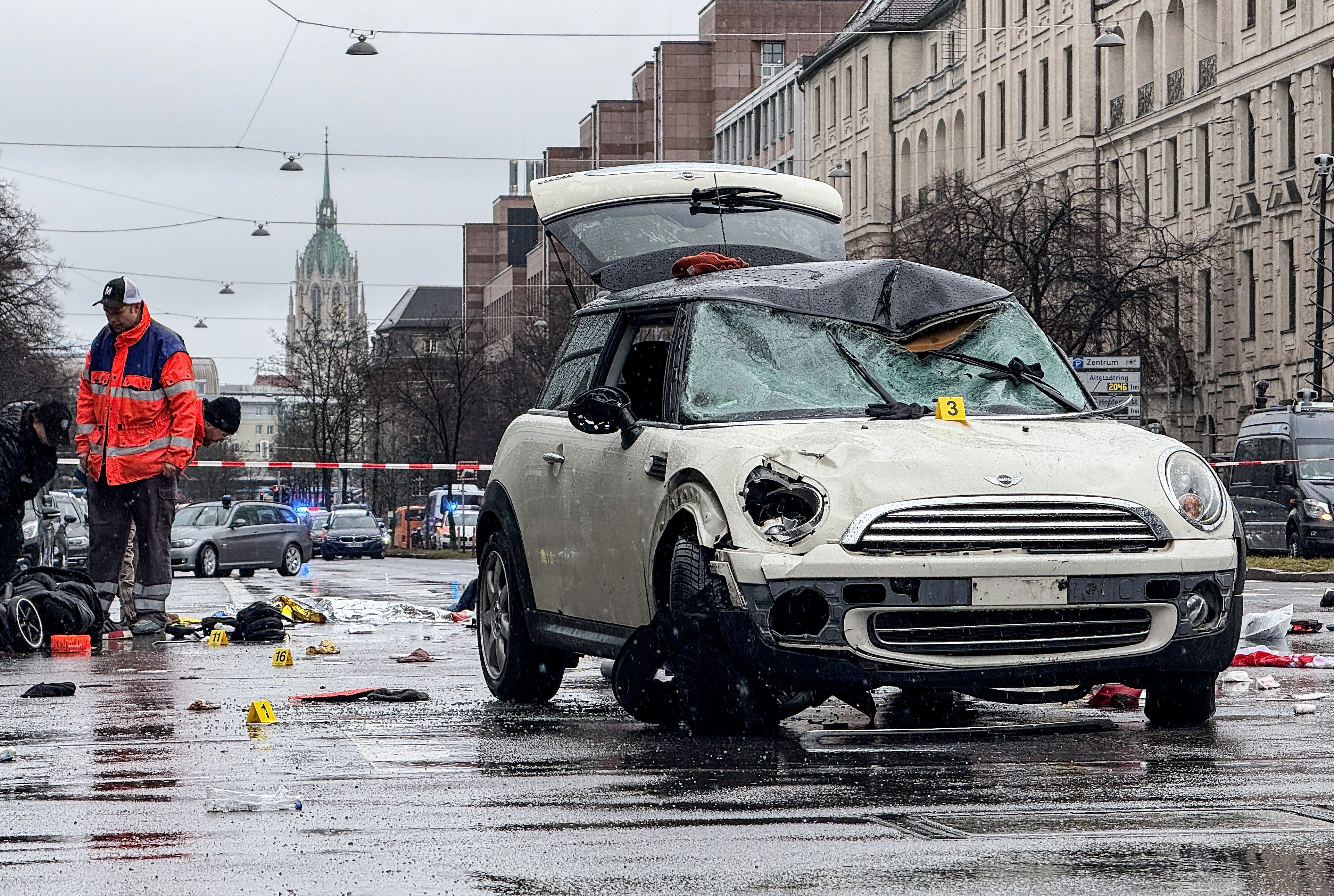 A damaged car at the scene after a vehicle was driven into a trade union demonstration in Munich, Germany