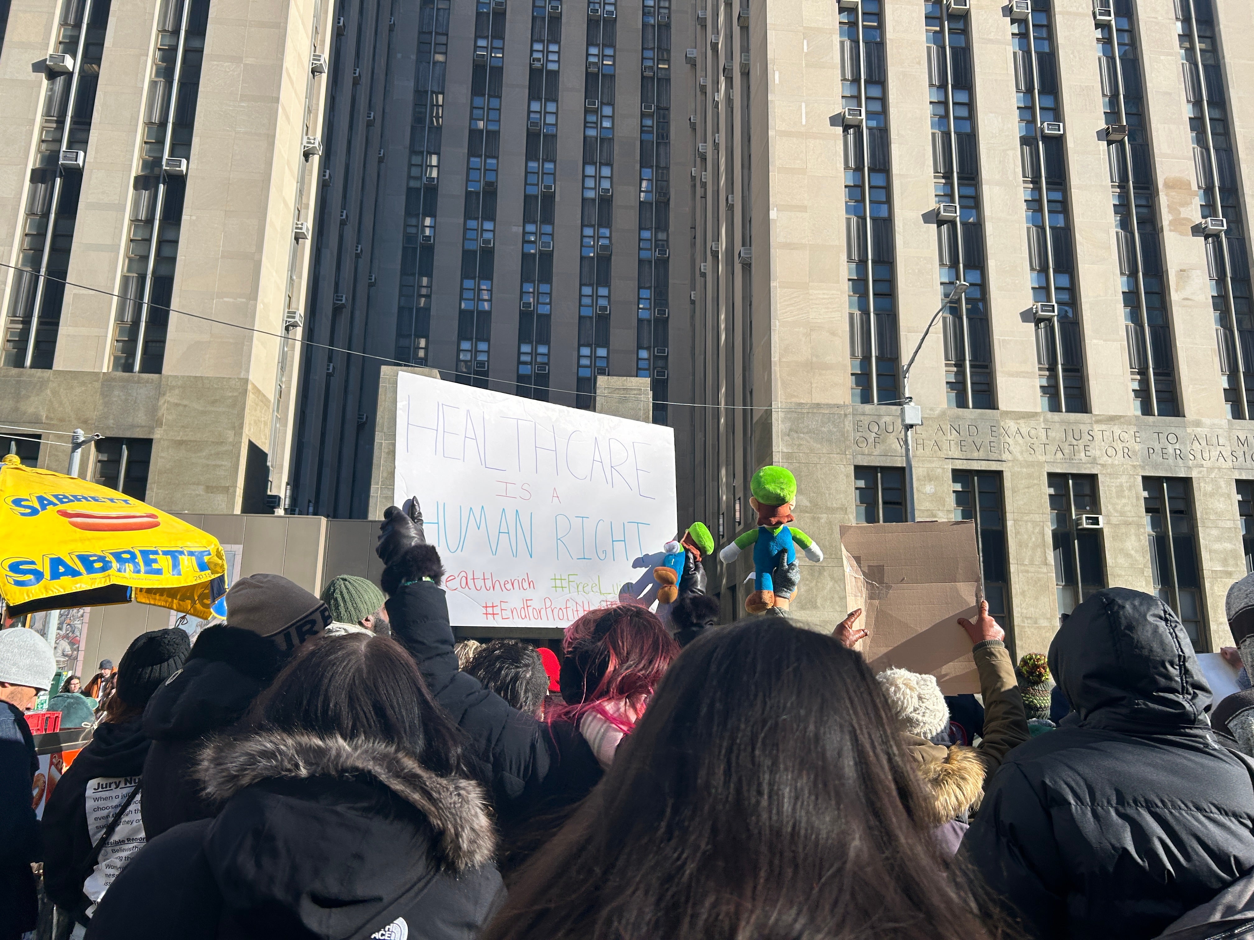 Protesters holding up Luigi plush toys and signs calling for healthcare reform packed outside of New York Criminal Court, where Mangione made an appearance at a pretrial hearing