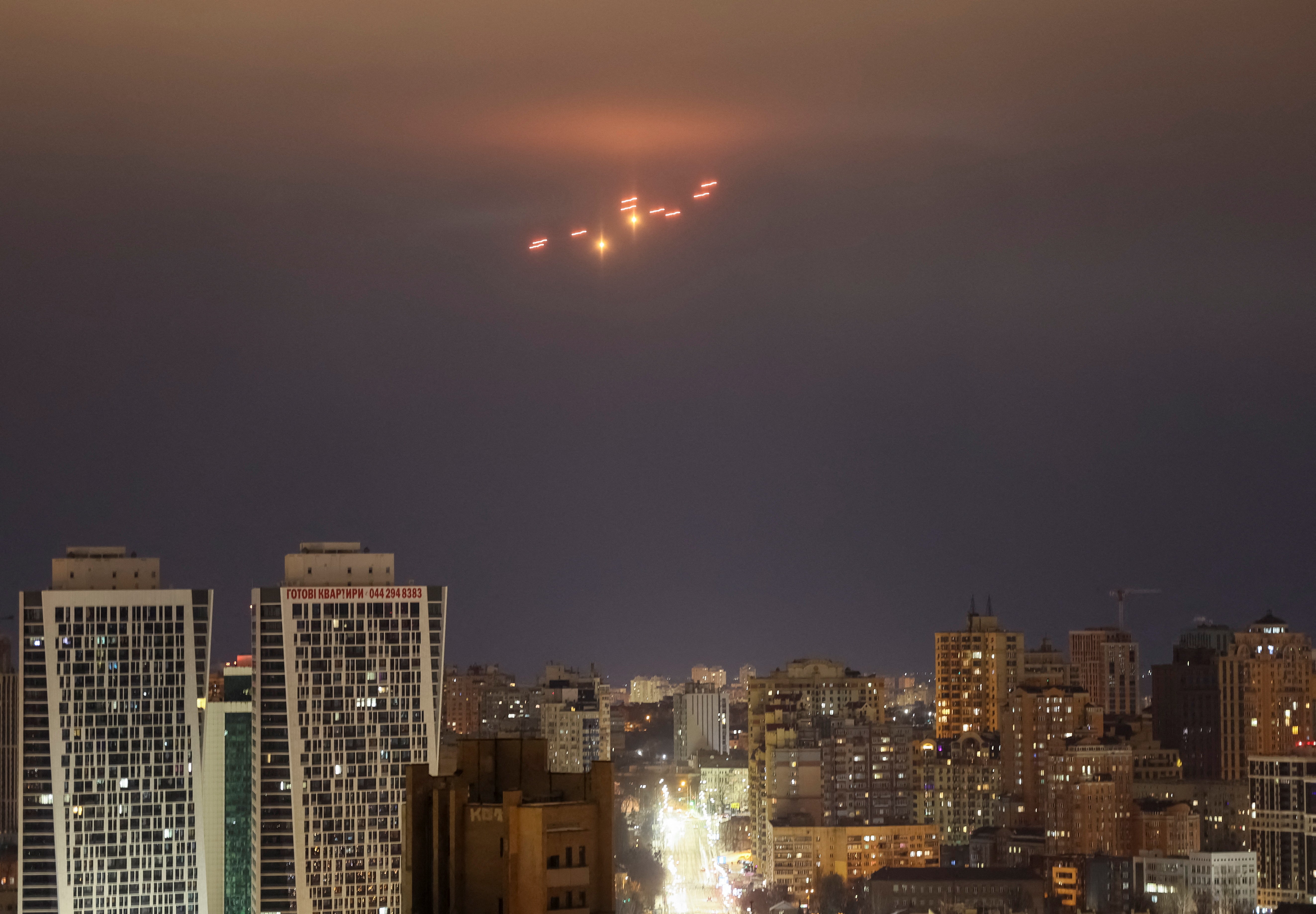 Explosions are seen in the sky over the city during a Russian drone strike, amid Russia's attack on Ukraine, in Kyiv, Ukraine February 20, 2025