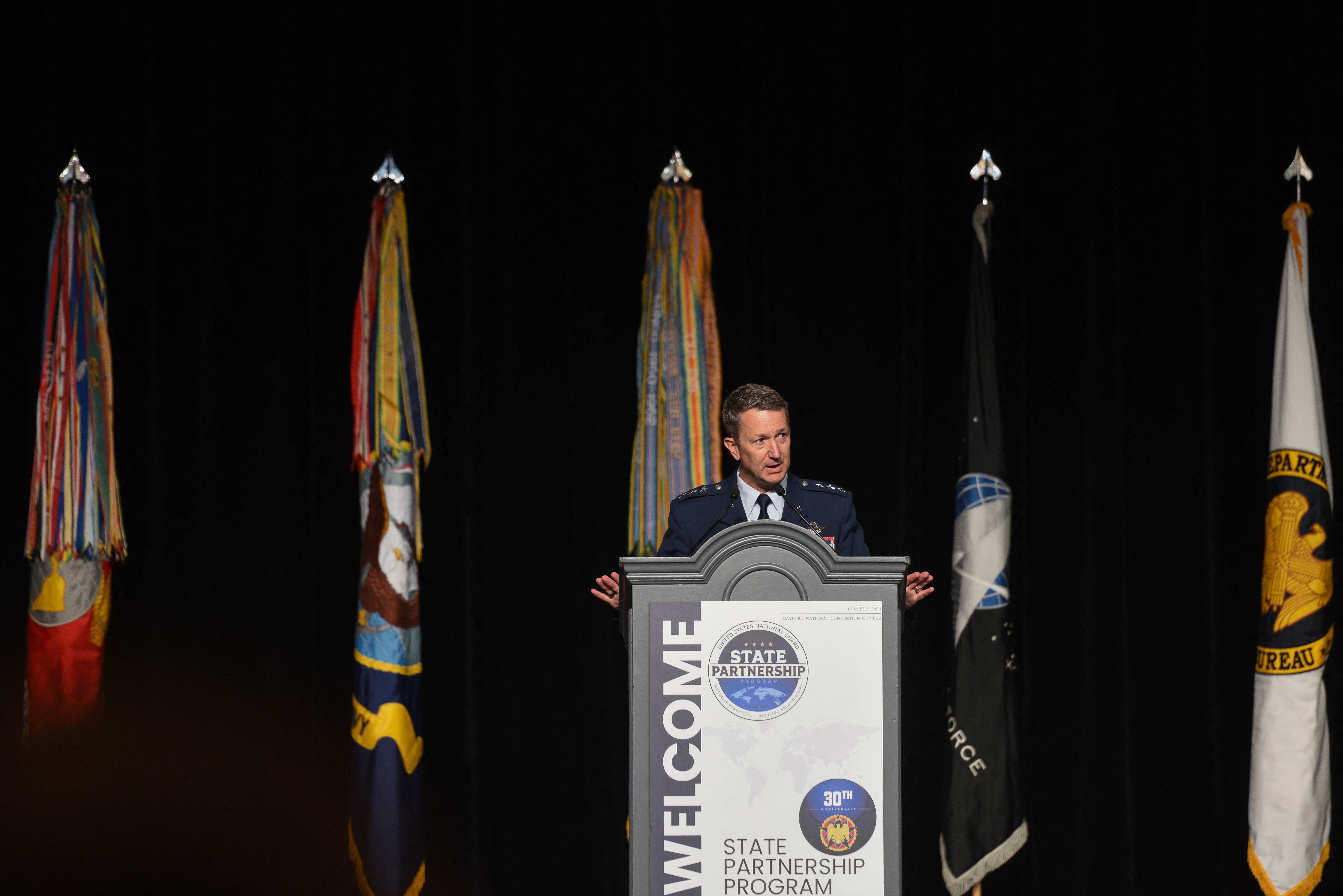 Air Force Lieutenant Geneneral Dan Caine, associate director for military affairs with the Central Intelligence Agency, speaking about global threats and challenges during the Department of Defense and National Guard State Partnership Program 30th Anniversary Conference at National Harbor, Maryland, July 17, 2023