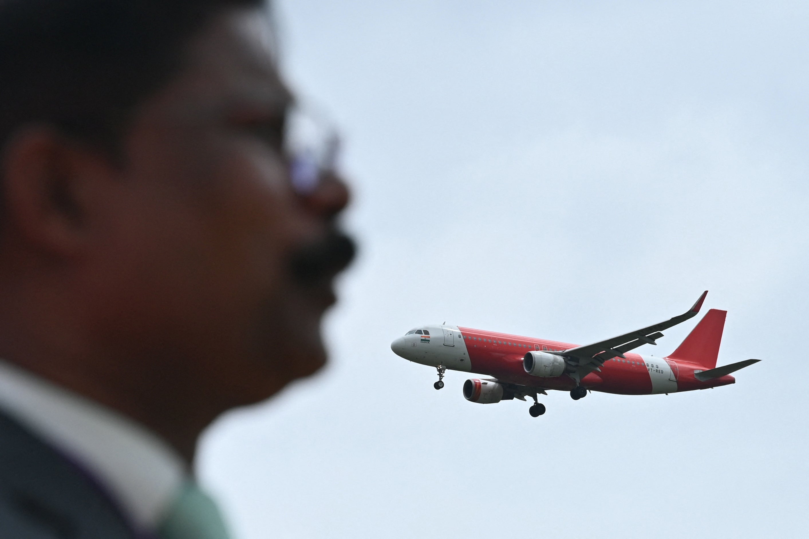 An Air India Express aircraft prepares to land at Kempegowda International Airport in Bengaluru