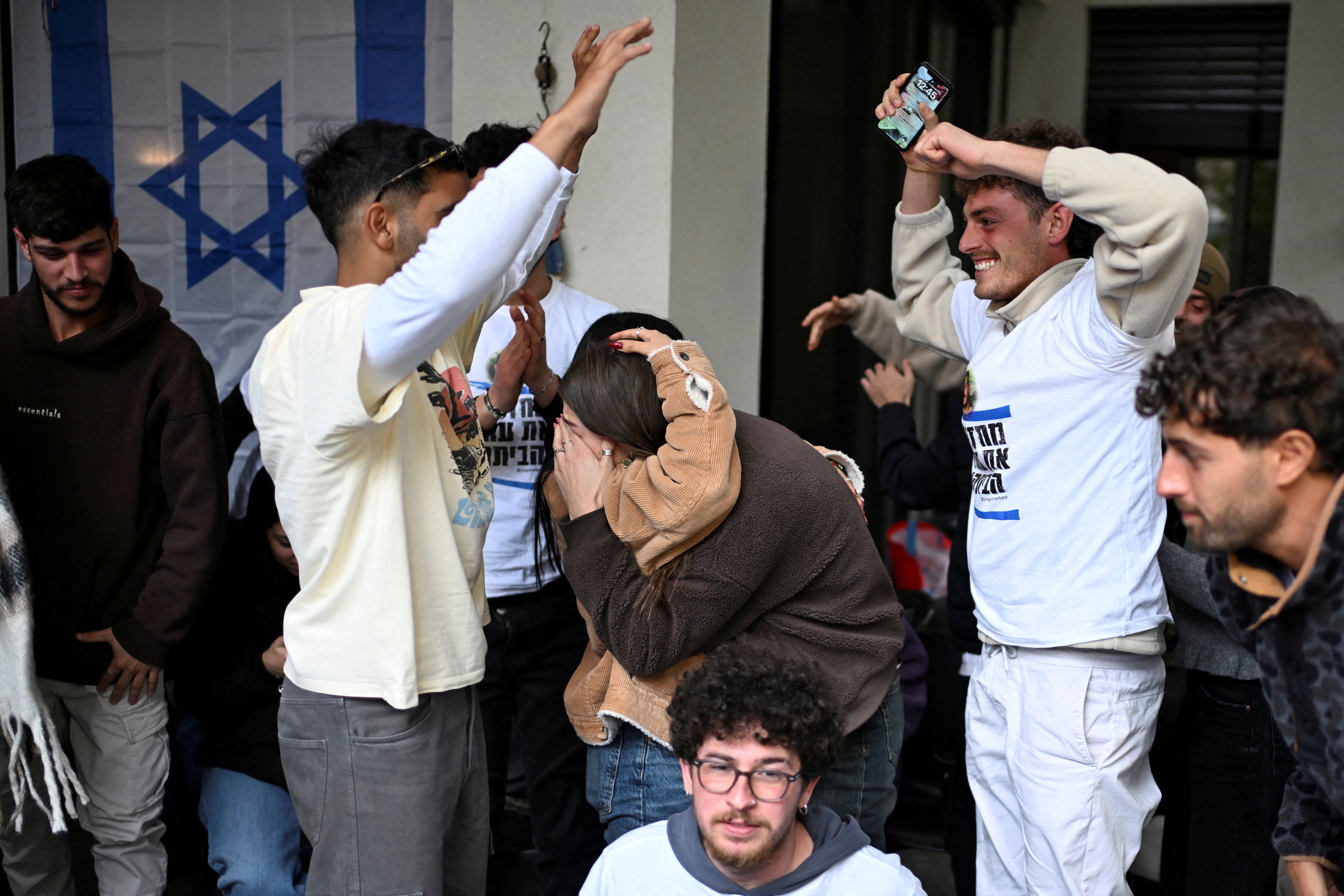 Families and supporters react as they celebrate the release of Omer Wenkert