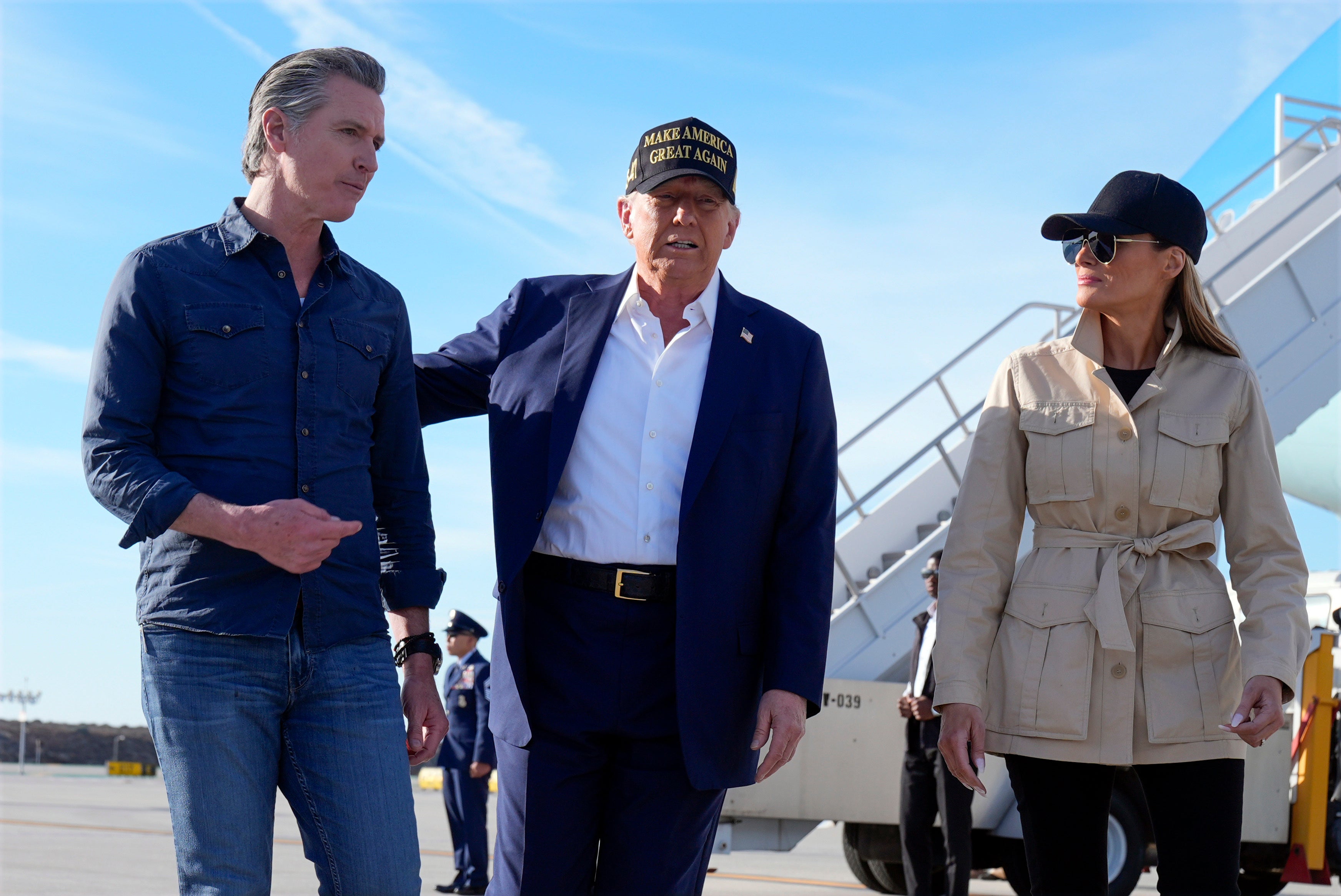 President Donald Trump and first lady Melania Trump walk with California Gov. Gavin Newsom after arriving on Air Force One at Los Angeles International Airport on January 24, 2025