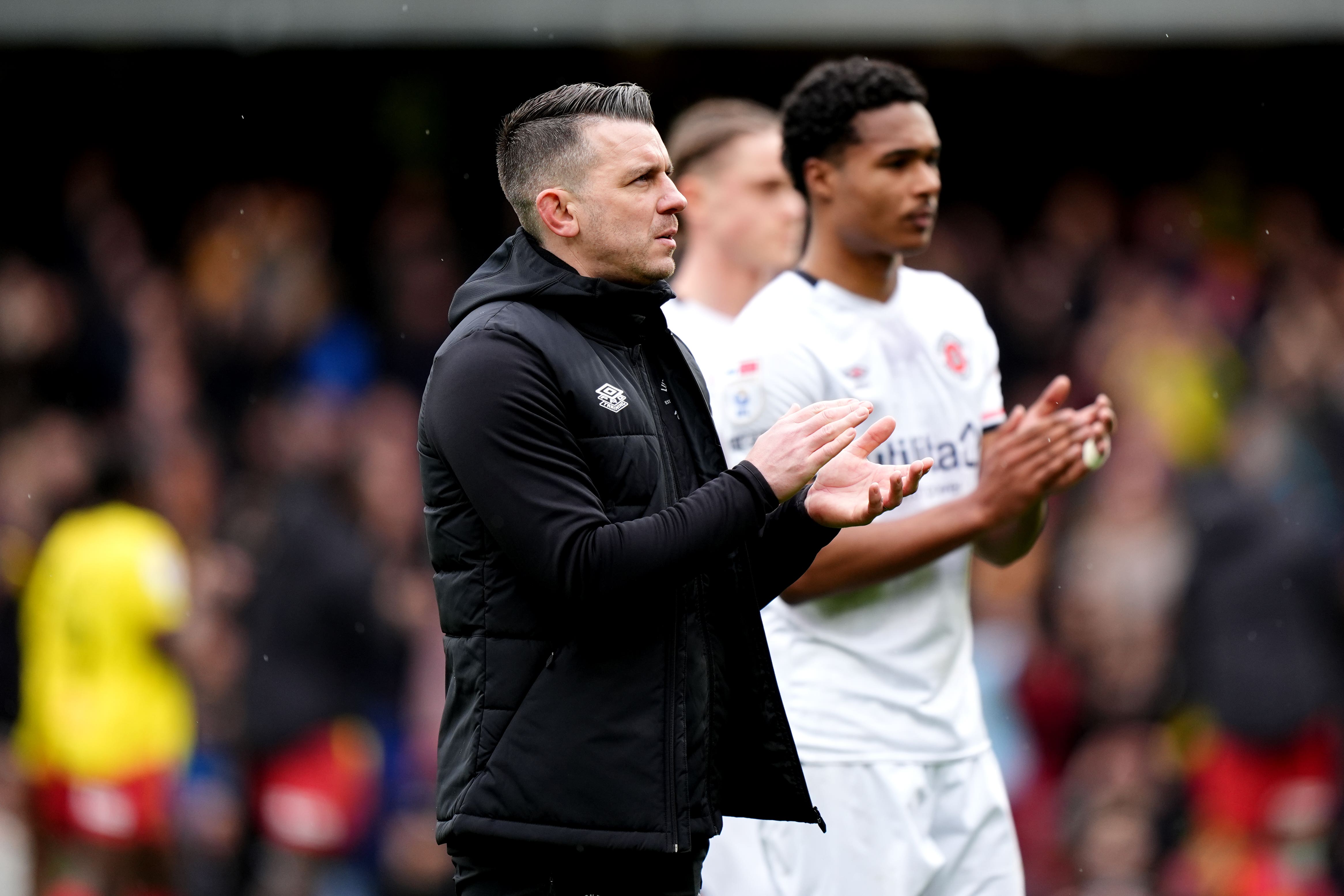 Luton manager Matt Bloomfield applauds the travelling fans after a 2-0 defeat at Watford (Zac Goodwin/PA).