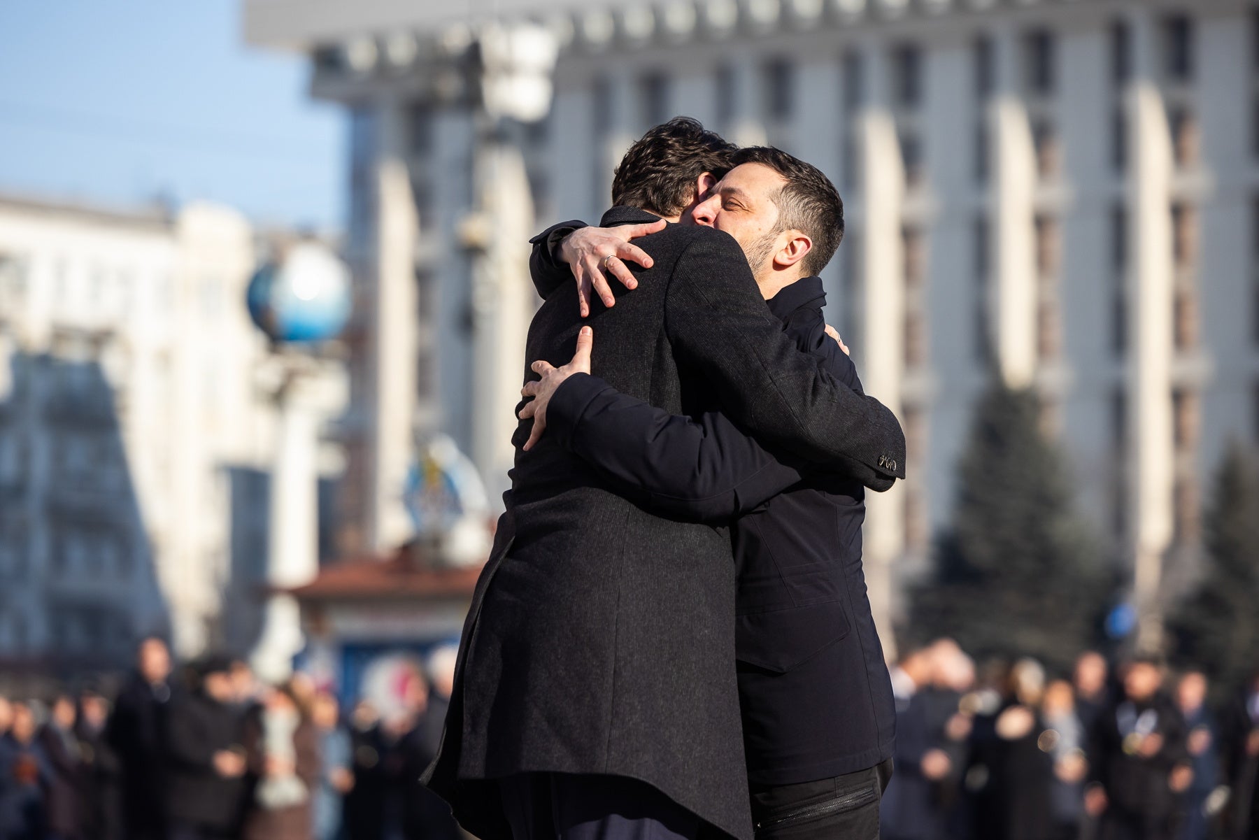 Ukraine's President Volodymyr Zelensky, right, greets Canada's then-Prime Minister Justin Trudeau during a ceremony in Kyiv in February 2025