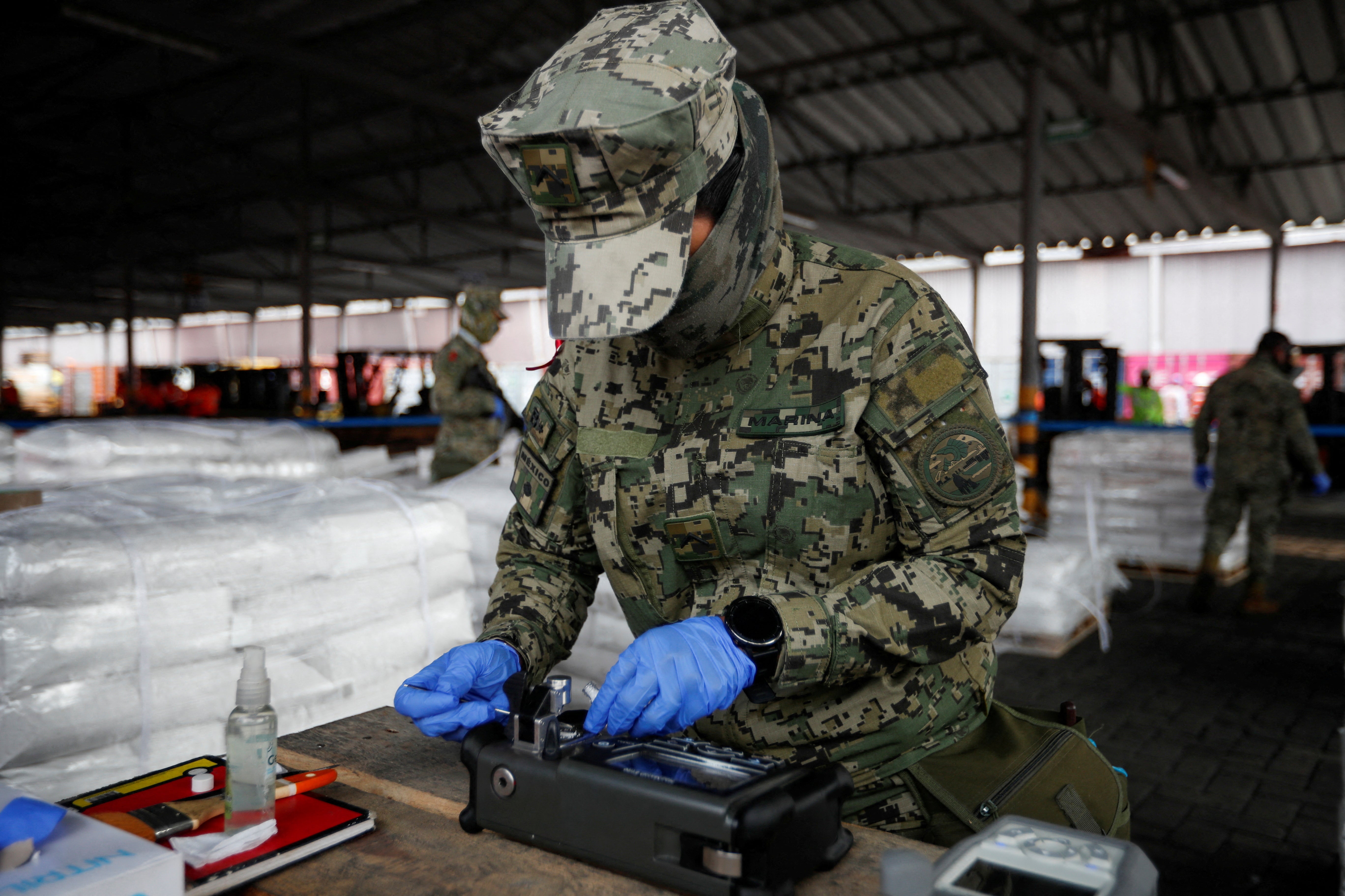FILE PHOTO: A member of the Mexican navy tests a shipment of dual-use chemical at the Port of Manzanillo as a measure to prevent the smuggling of prohibited substances in 2023