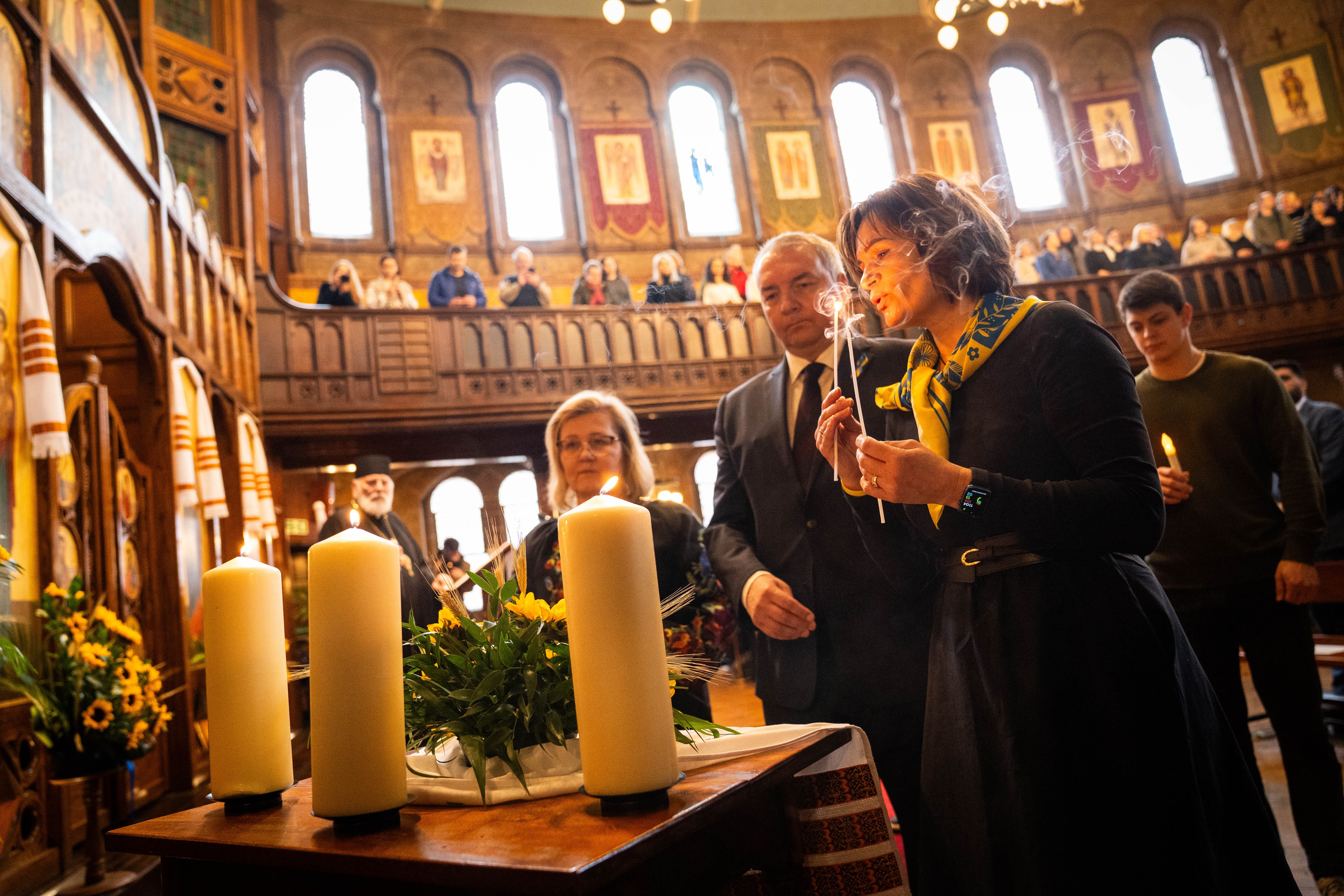 Three candles were lit during the service to mark the anniversary (James Manning/PA)