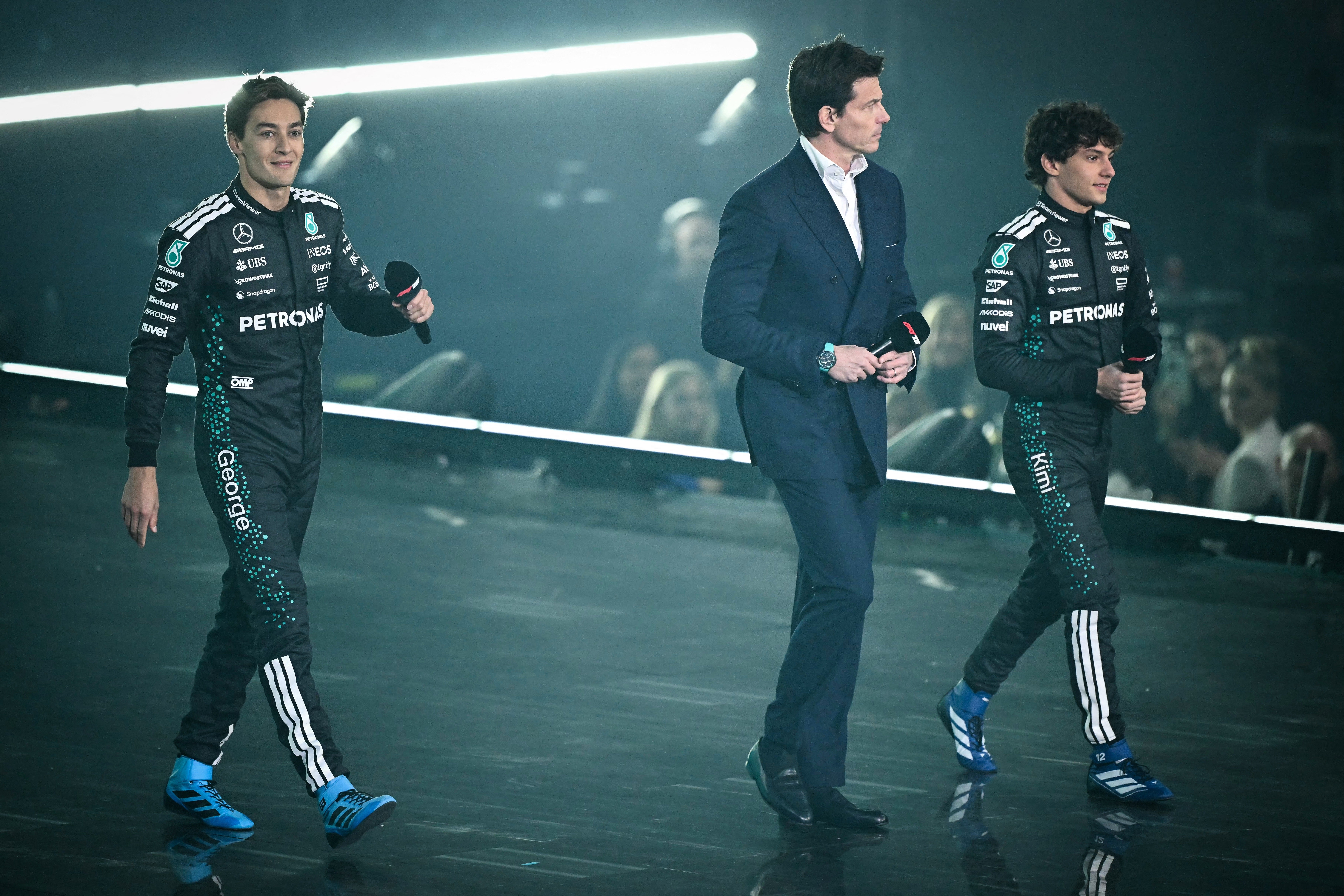 Russell and Kimi Antonelli have both been confirmed as Mercedes’s 2026 driver line-up by F1 CEO Toto Wolff, centre