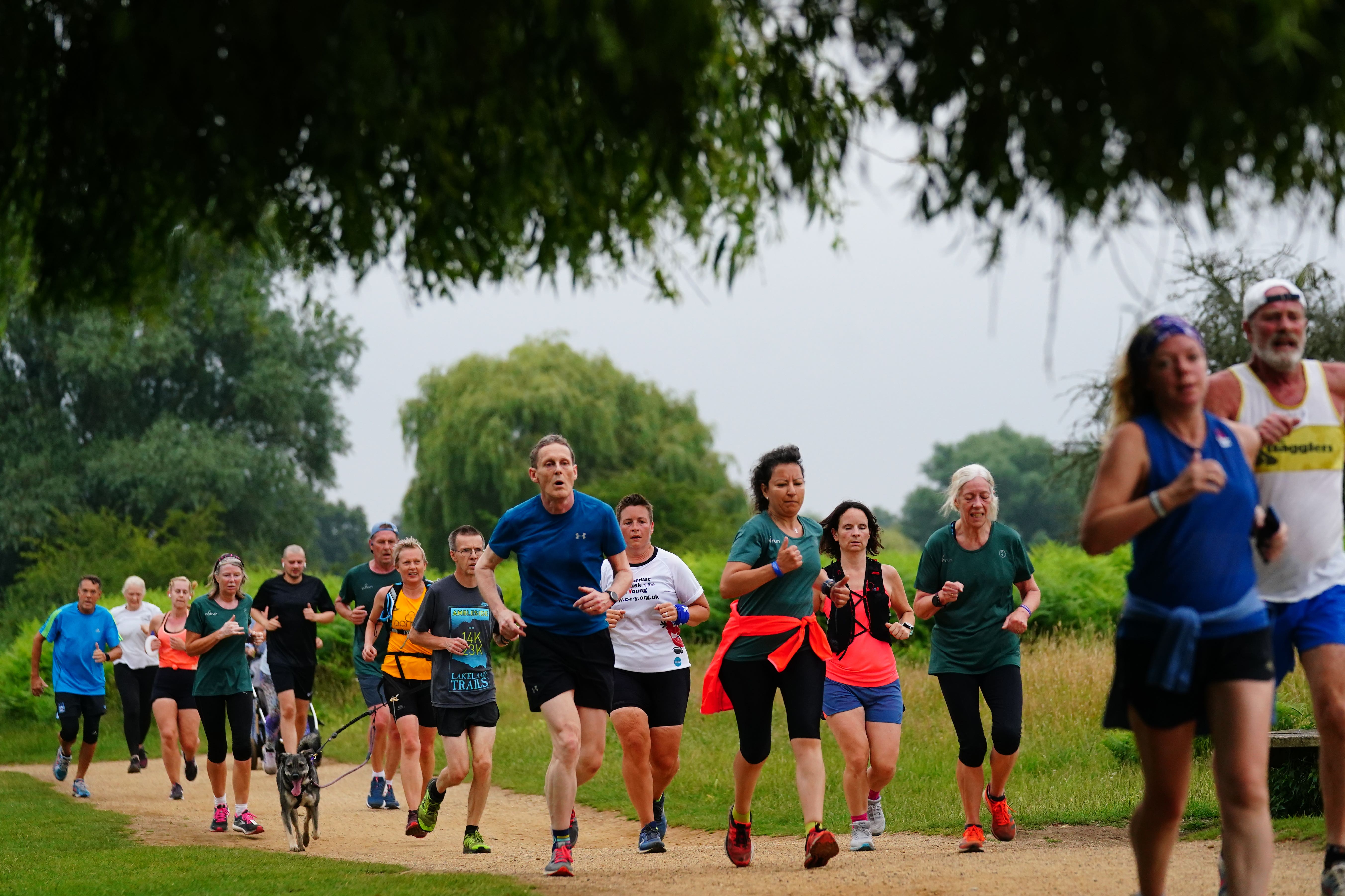 People take part in the parkrun at Bushy Park in London (Victoria Jones/PA)