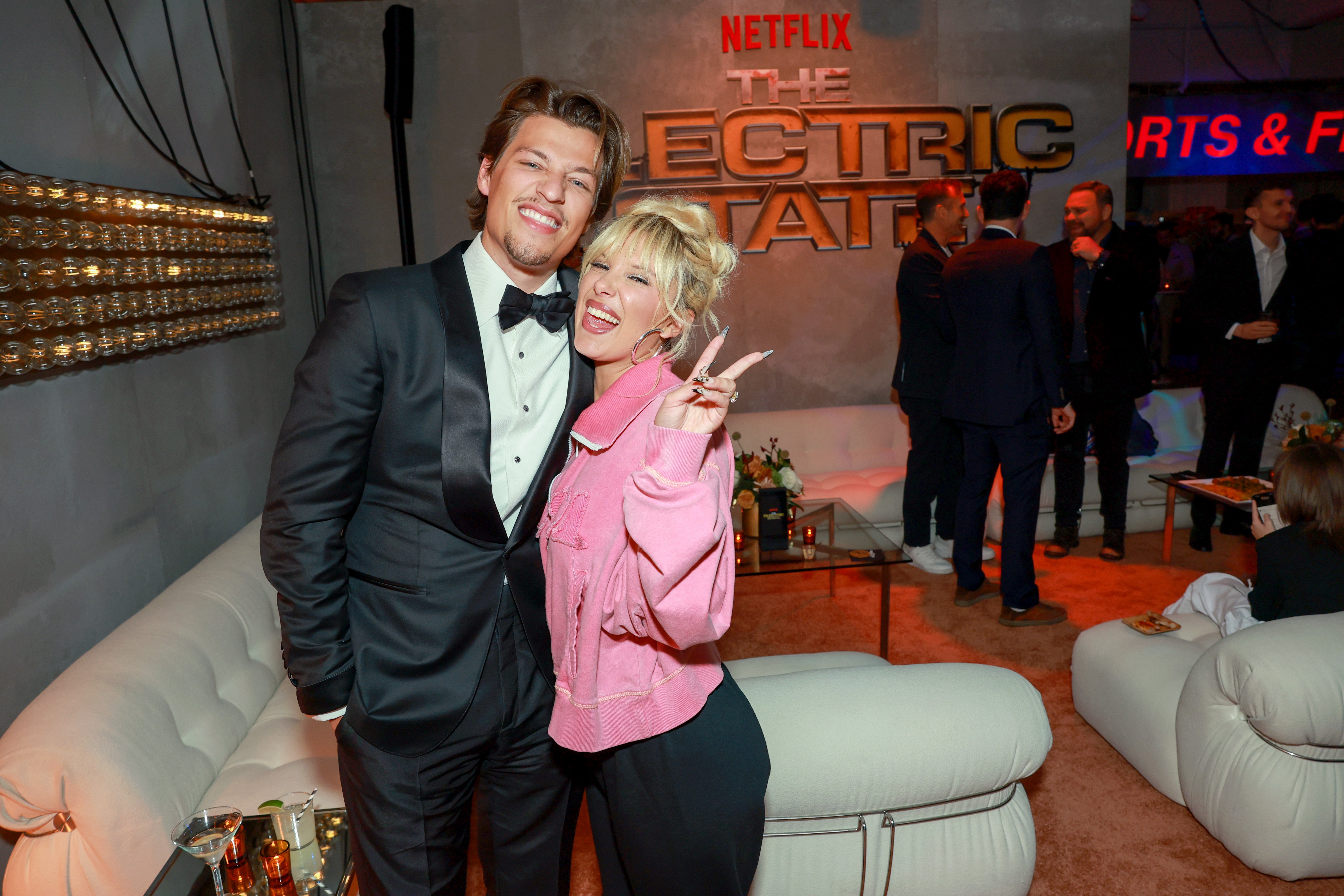 Brown with husband Jake Bongiovi at an event for the film in February 2025