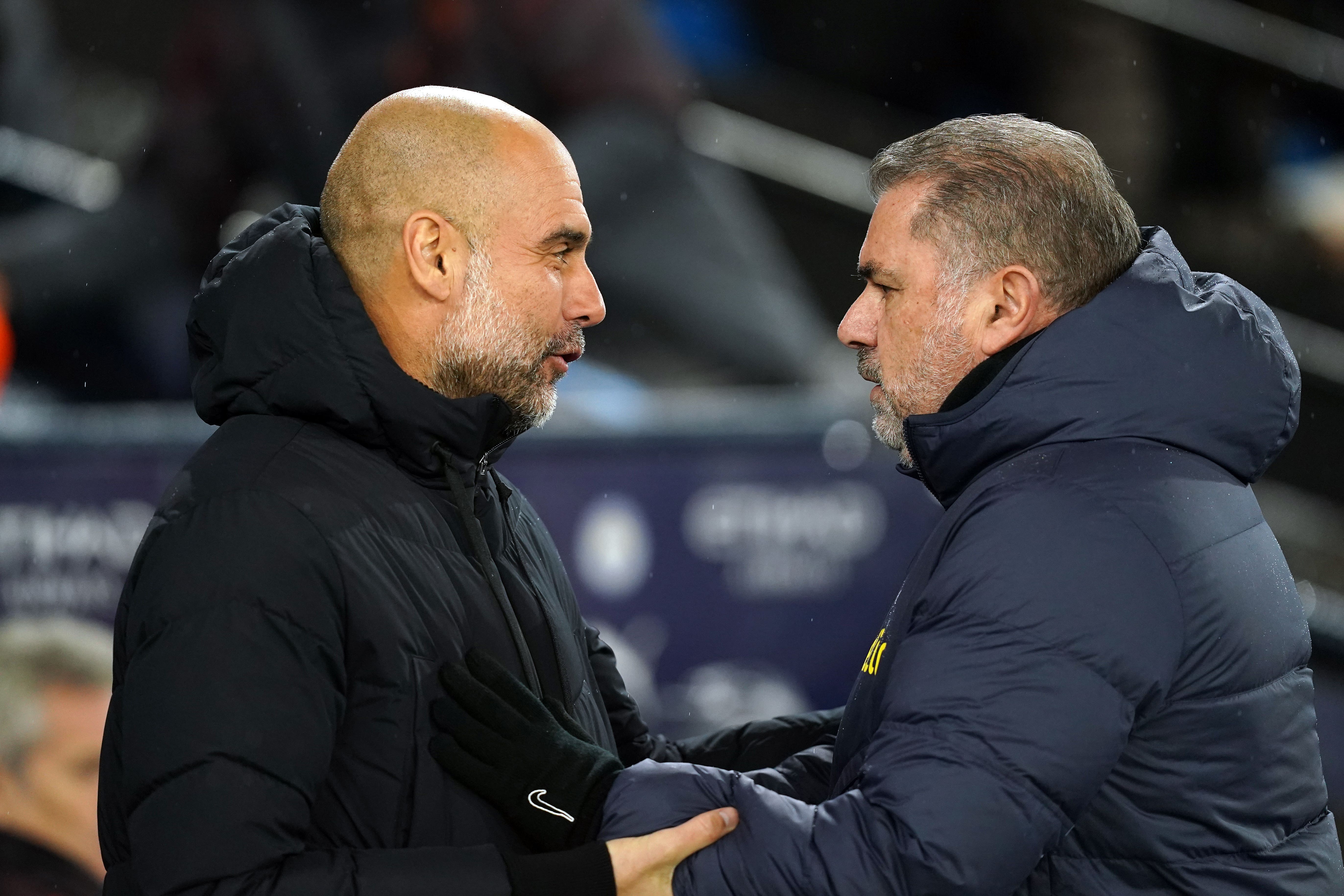 Man City boss Pep Guardiola and Tottenham manager Ange Postecoglou (Martin Rickett/PA)